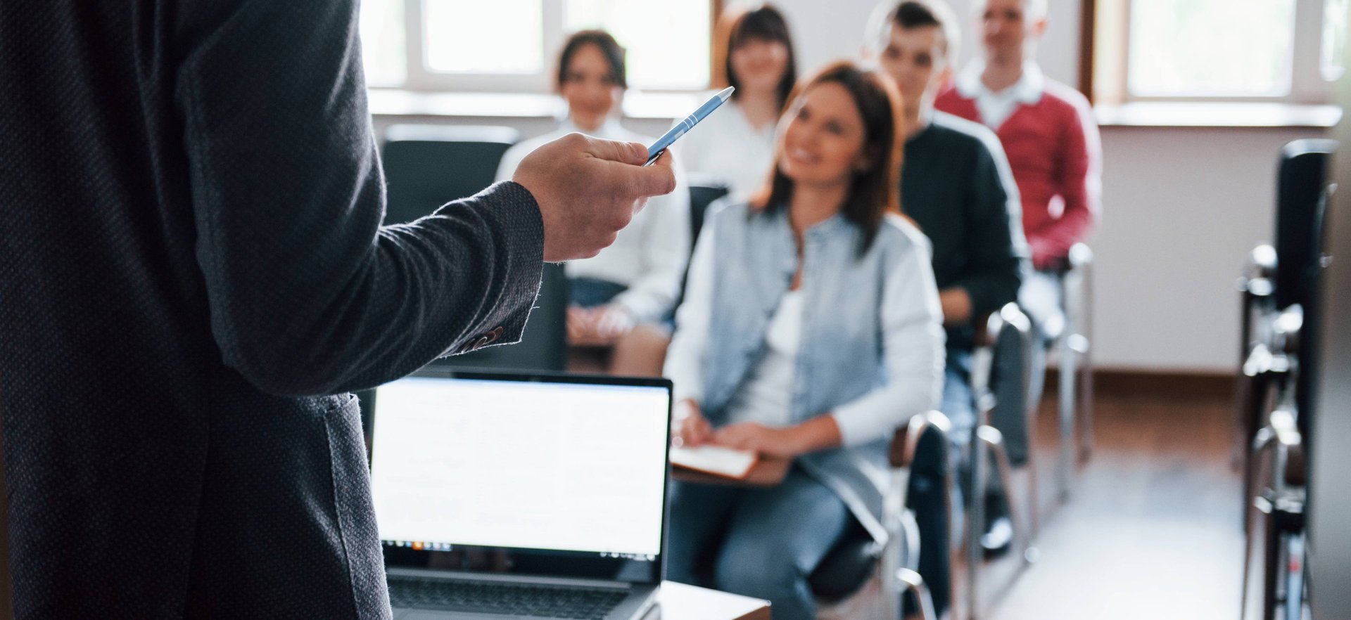 an abstract photo of a curved building with a blue sky in the background