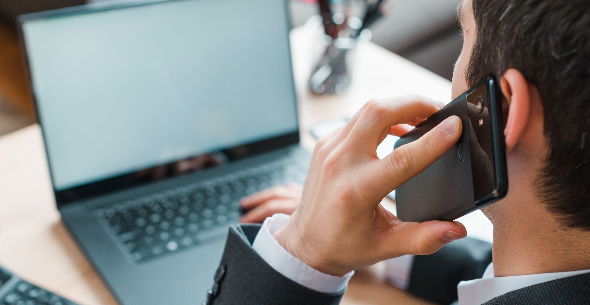 an abstract photo of a curved building with a blue sky in the background