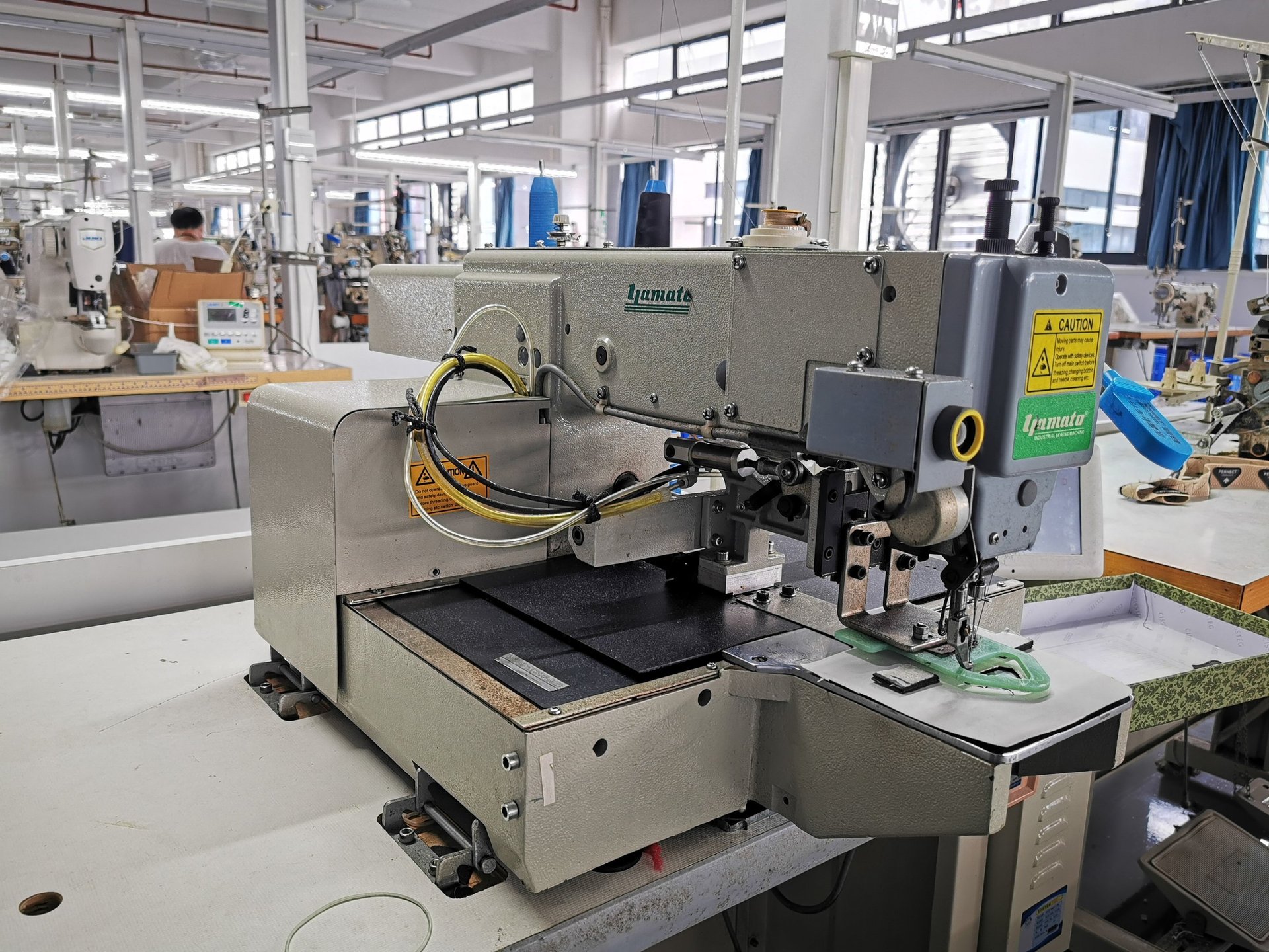 an abstract photo of a curved building with a blue sky in the background
