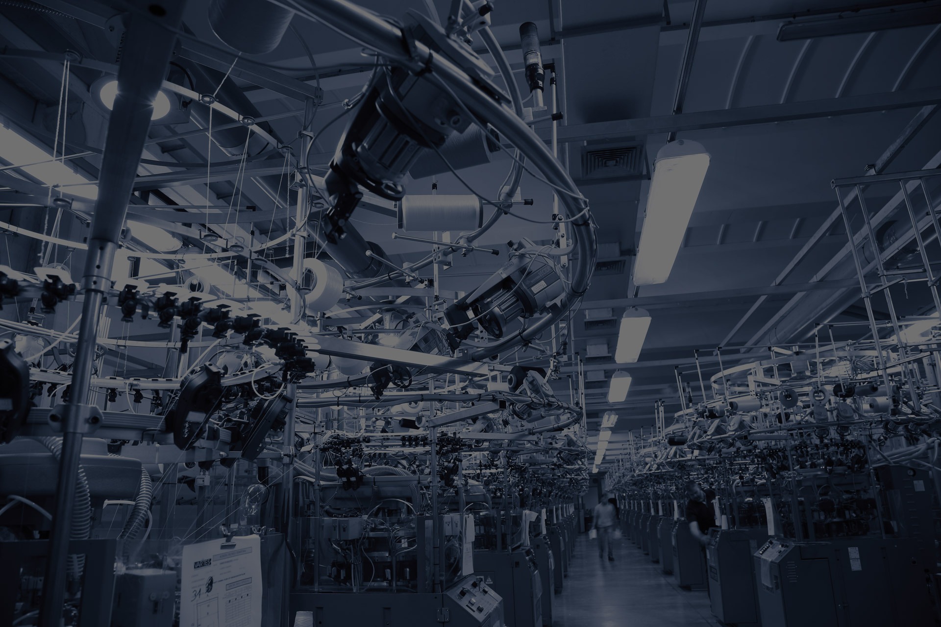 an abstract photo of a curved building with a blue sky in the background