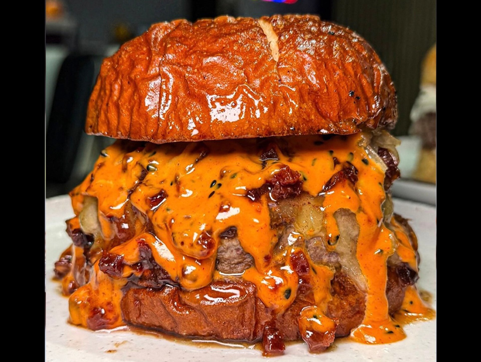 an abstract photo of a curved building with a blue sky in the background