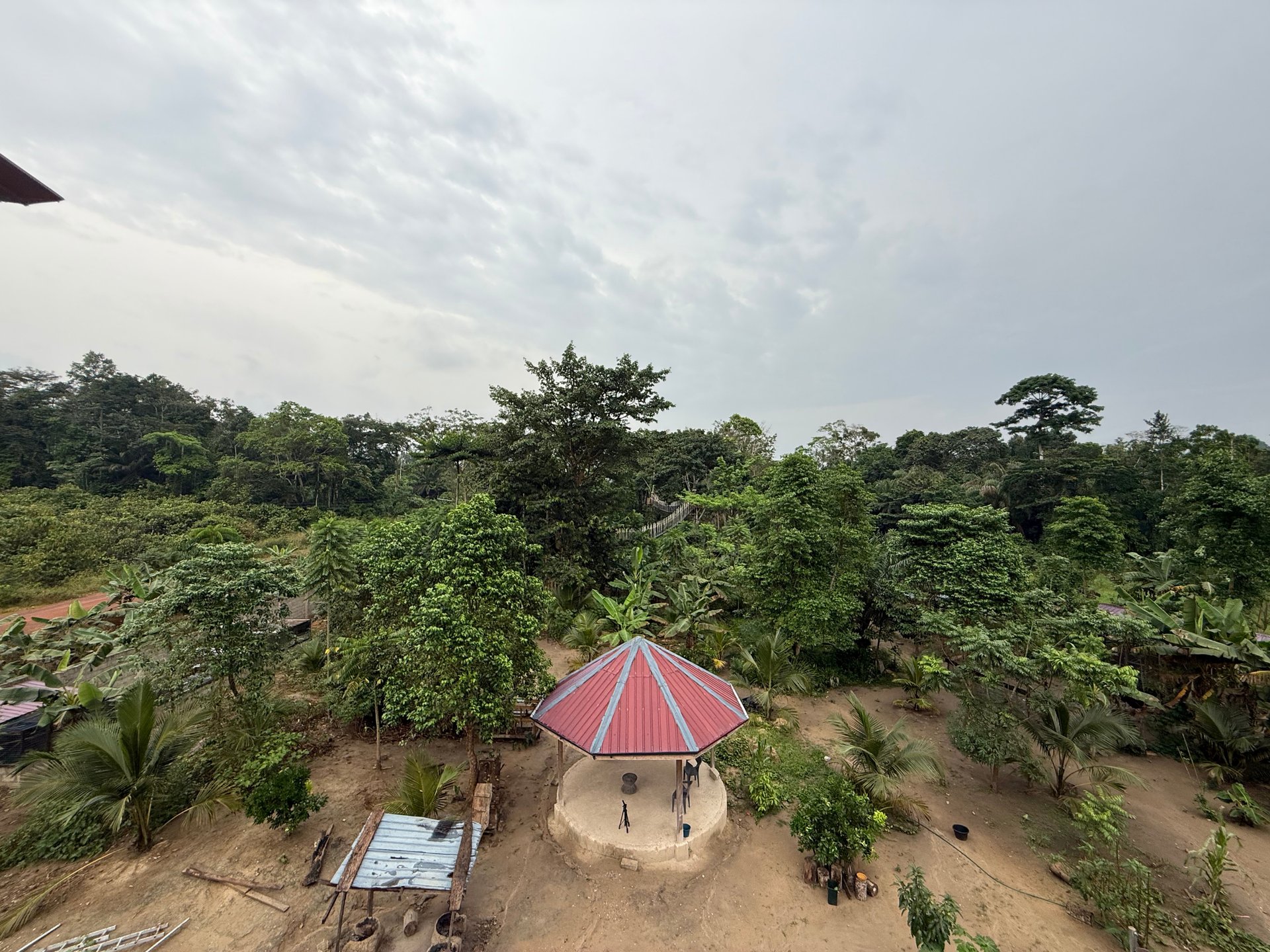 a kayak sitting on the shore of a lake at sunset