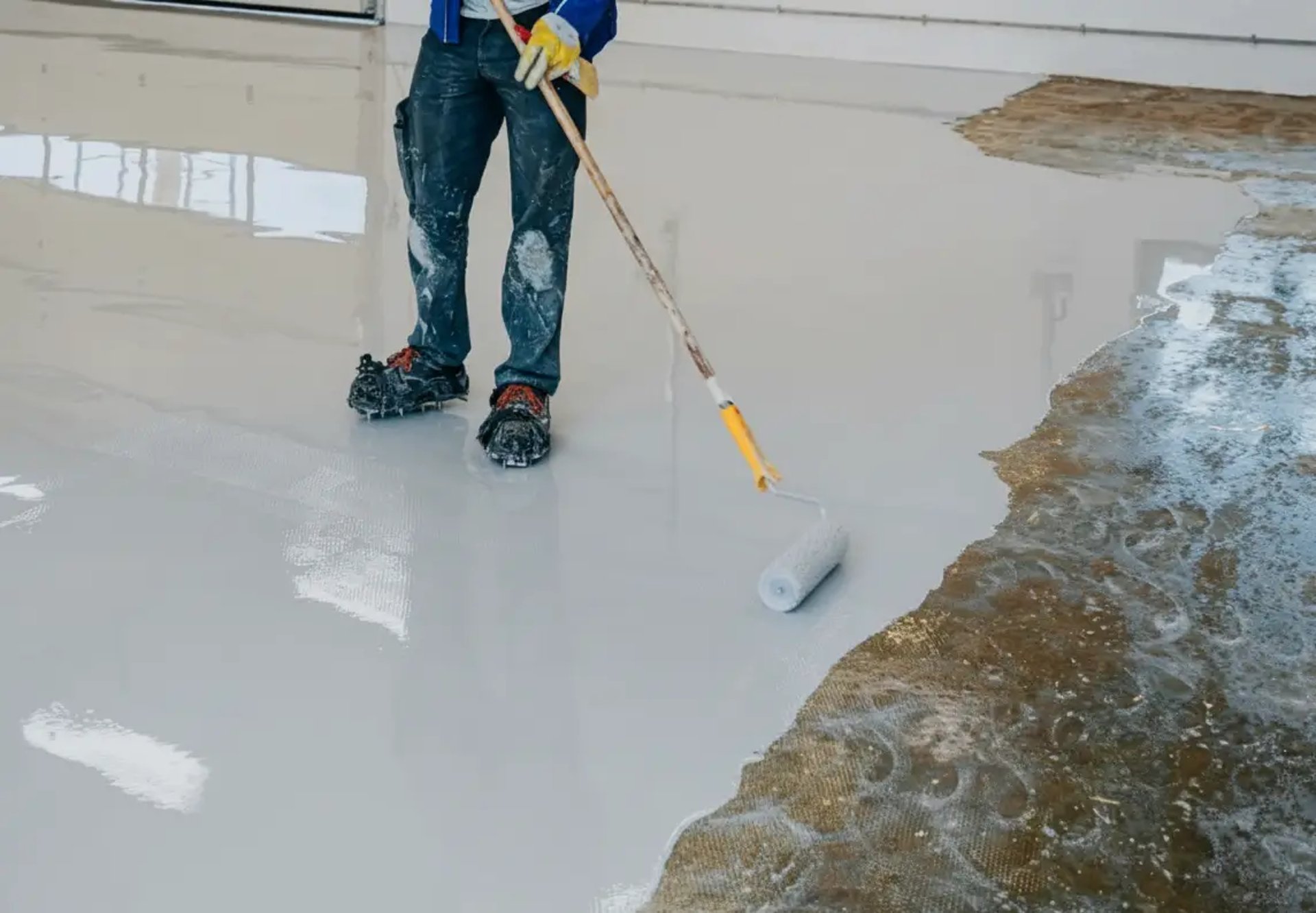 Man is doing Epoxy Flooring coating