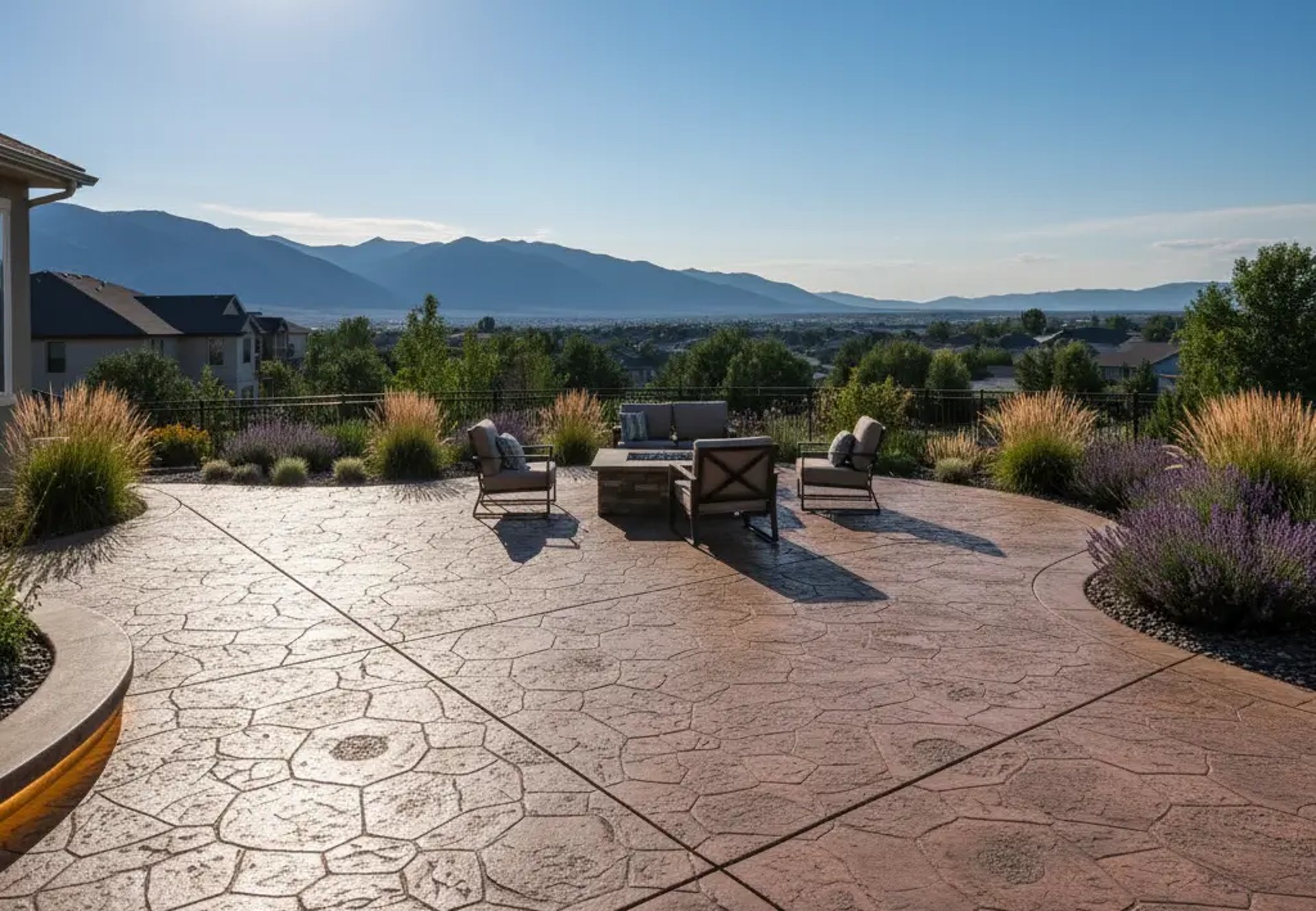 Decorative stamped concrete patio with stylish design at a suburban home in Riverton, Utah.