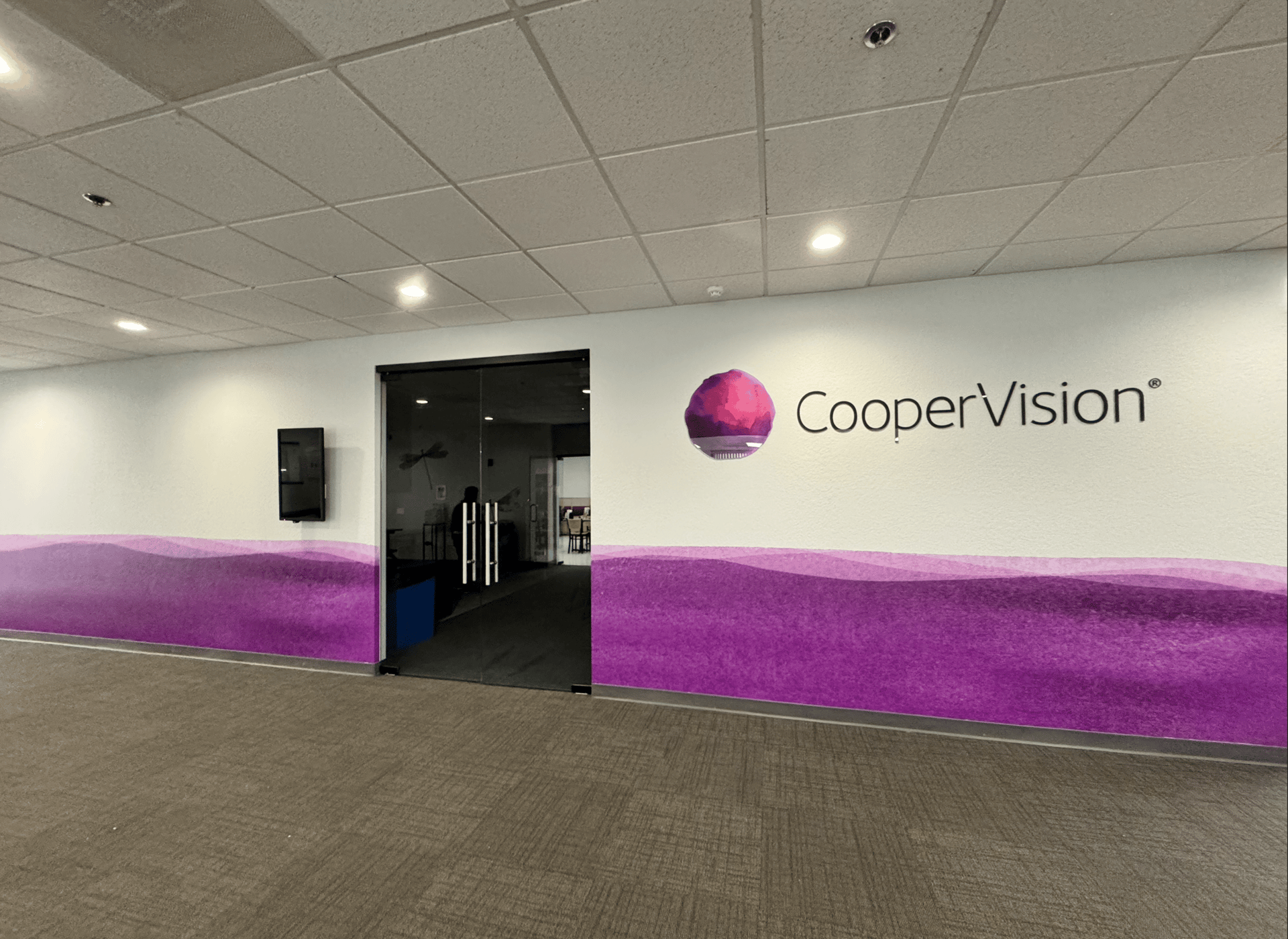 an abstract photo of a curved building with a blue sky in the background