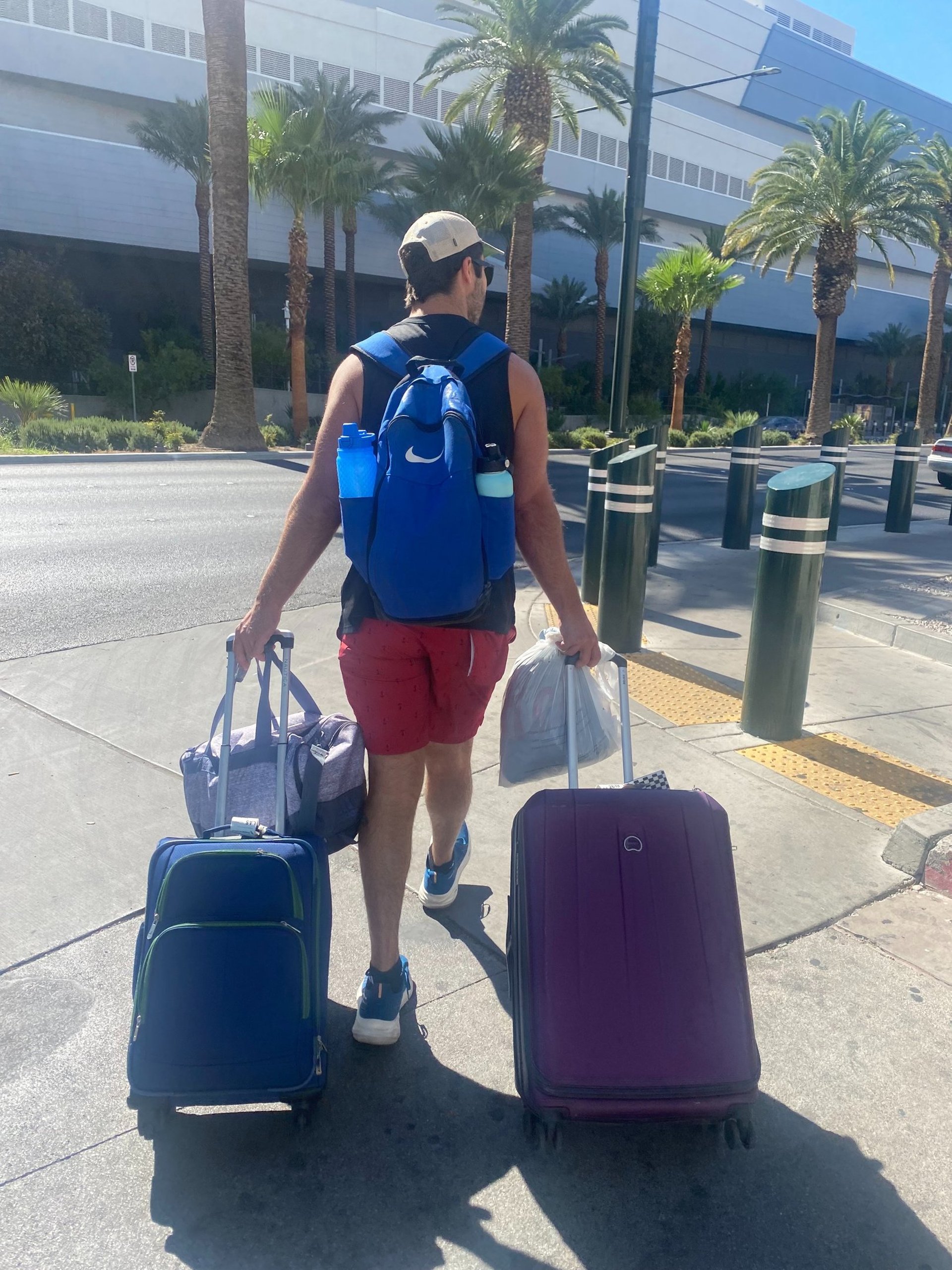 flat lay photography of camera, book, and bag