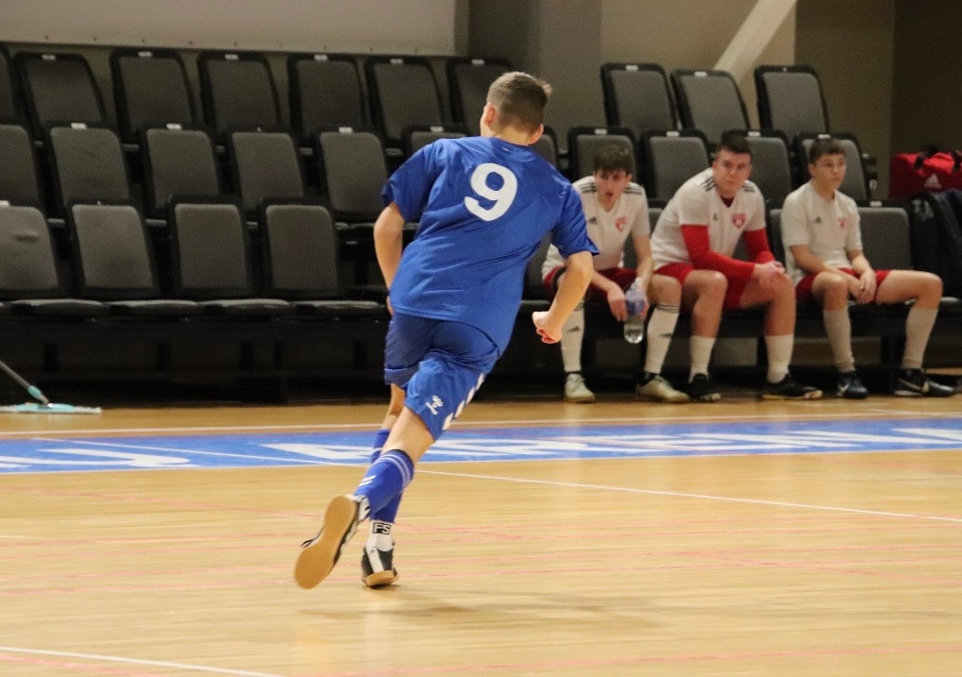 an abstract photo of a curved building with a blue sky in the background