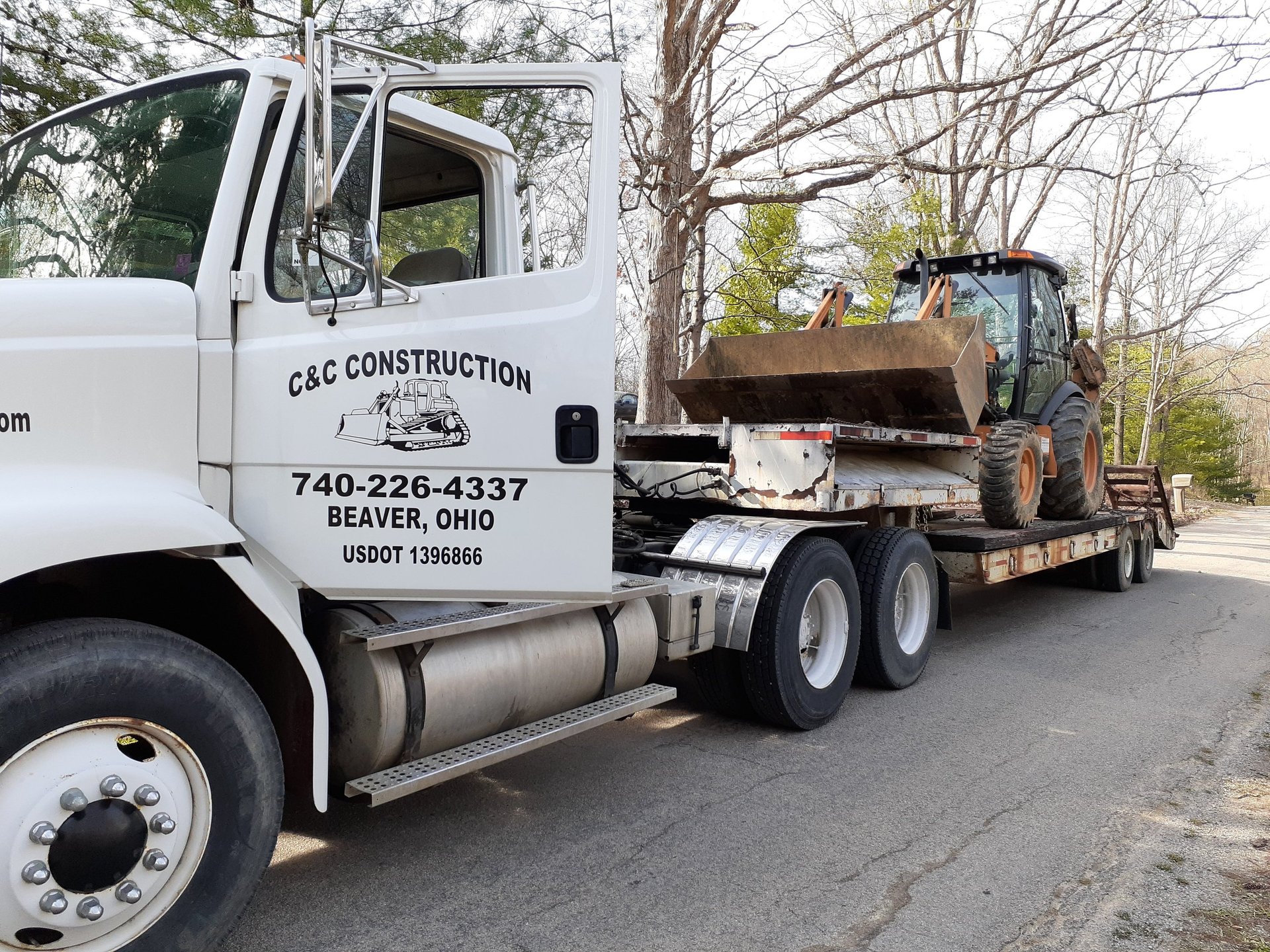 hauling backhoe to a job