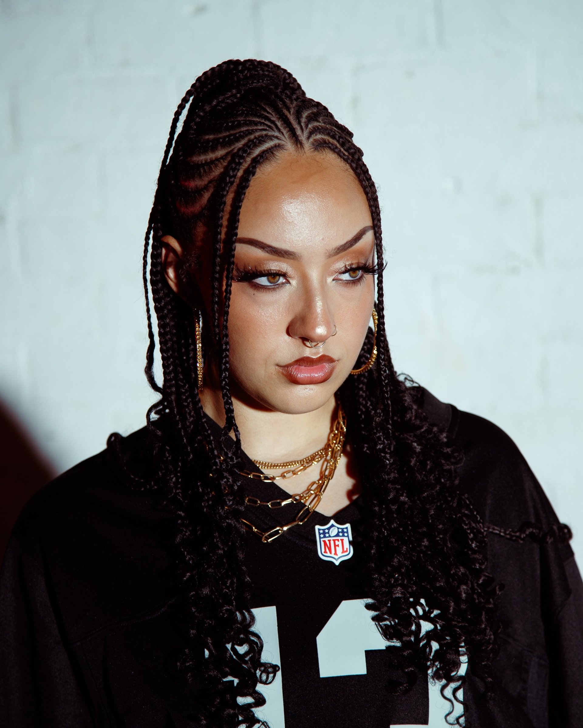 an abstract photo of a curved building with a blue sky in the background