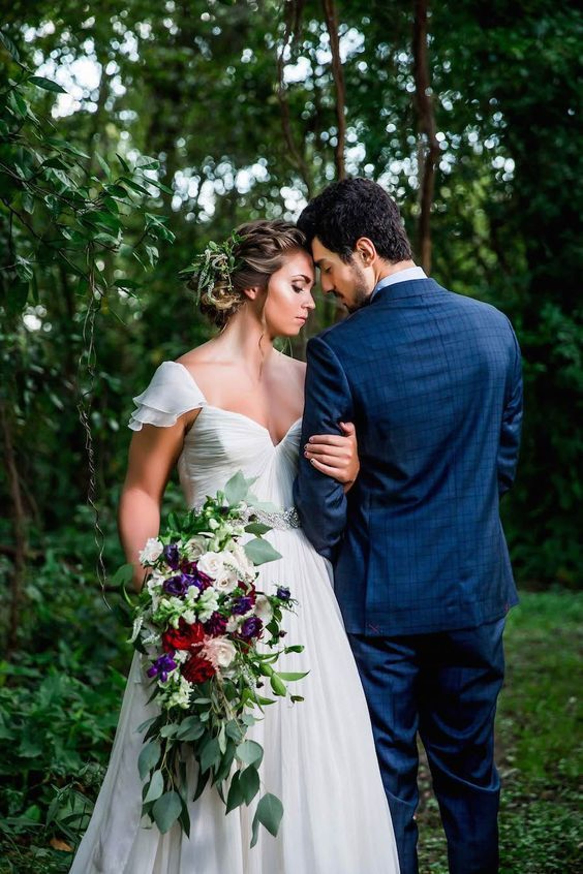 couple wearing silver-colored rings