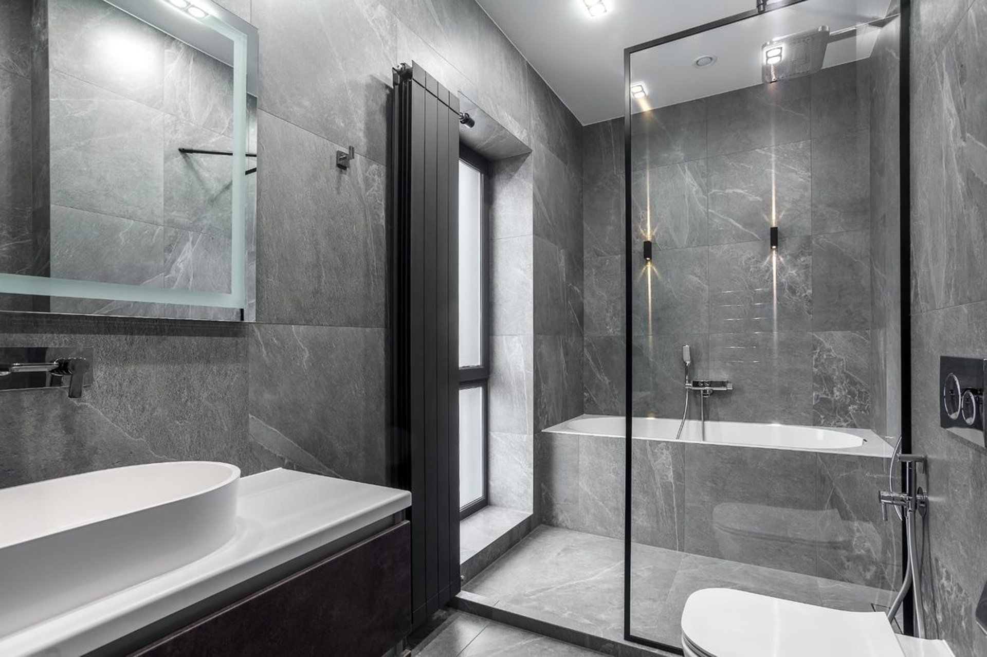 white ceramic bathtub near white framed window
