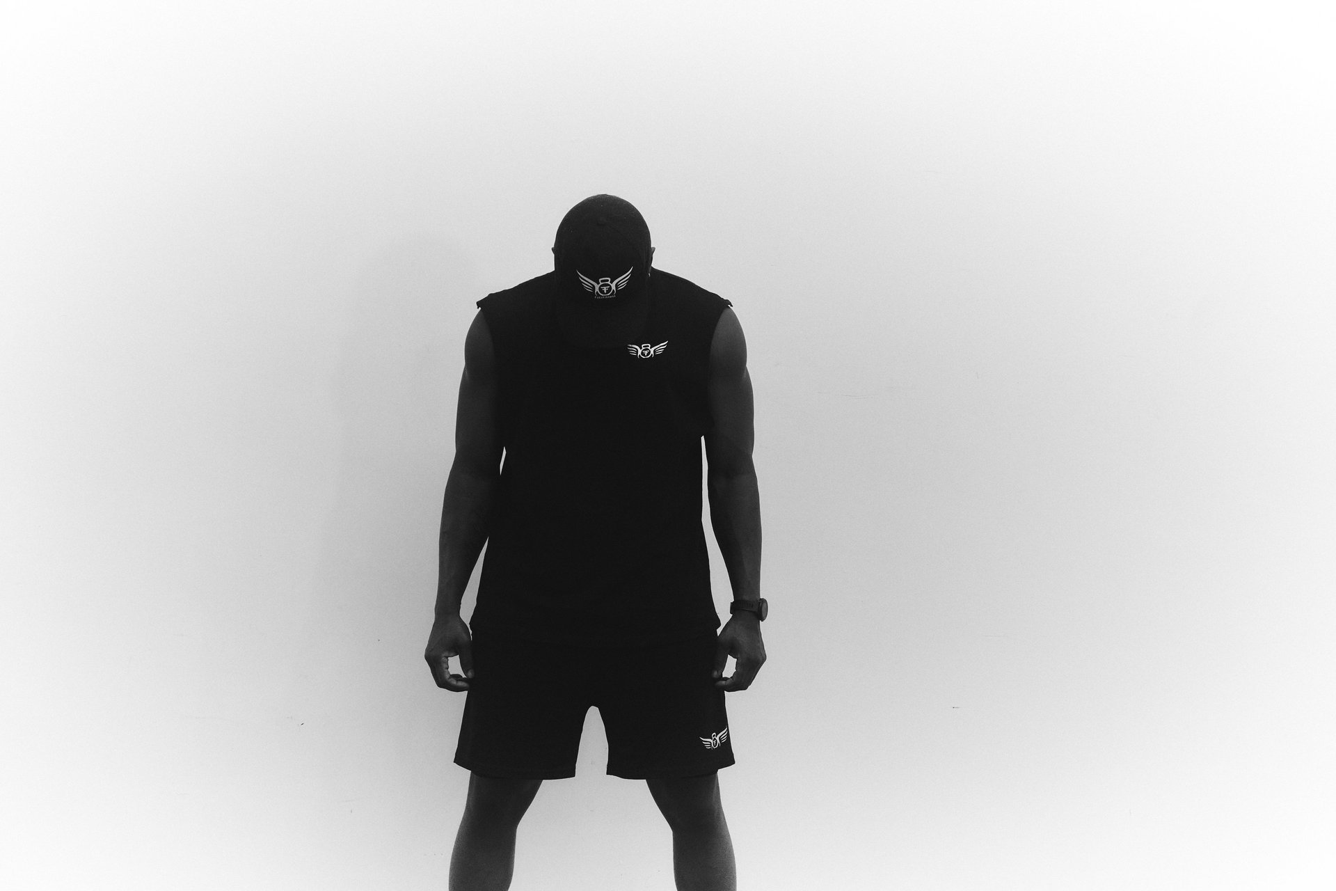 person wearing orange and gray Nike shoes walking on gray concrete stairs
