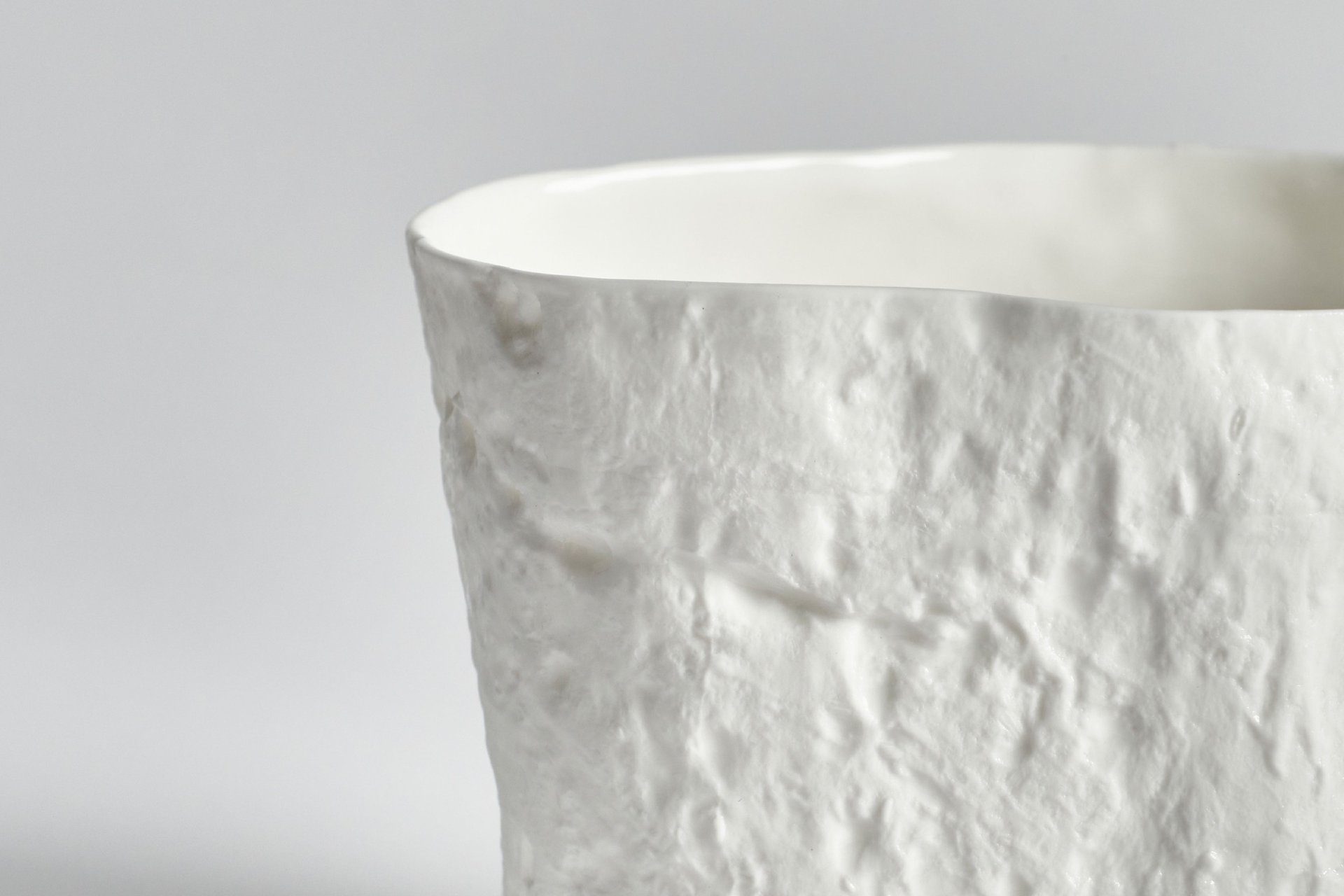 an abstract photo of a curved building with a blue sky in the background