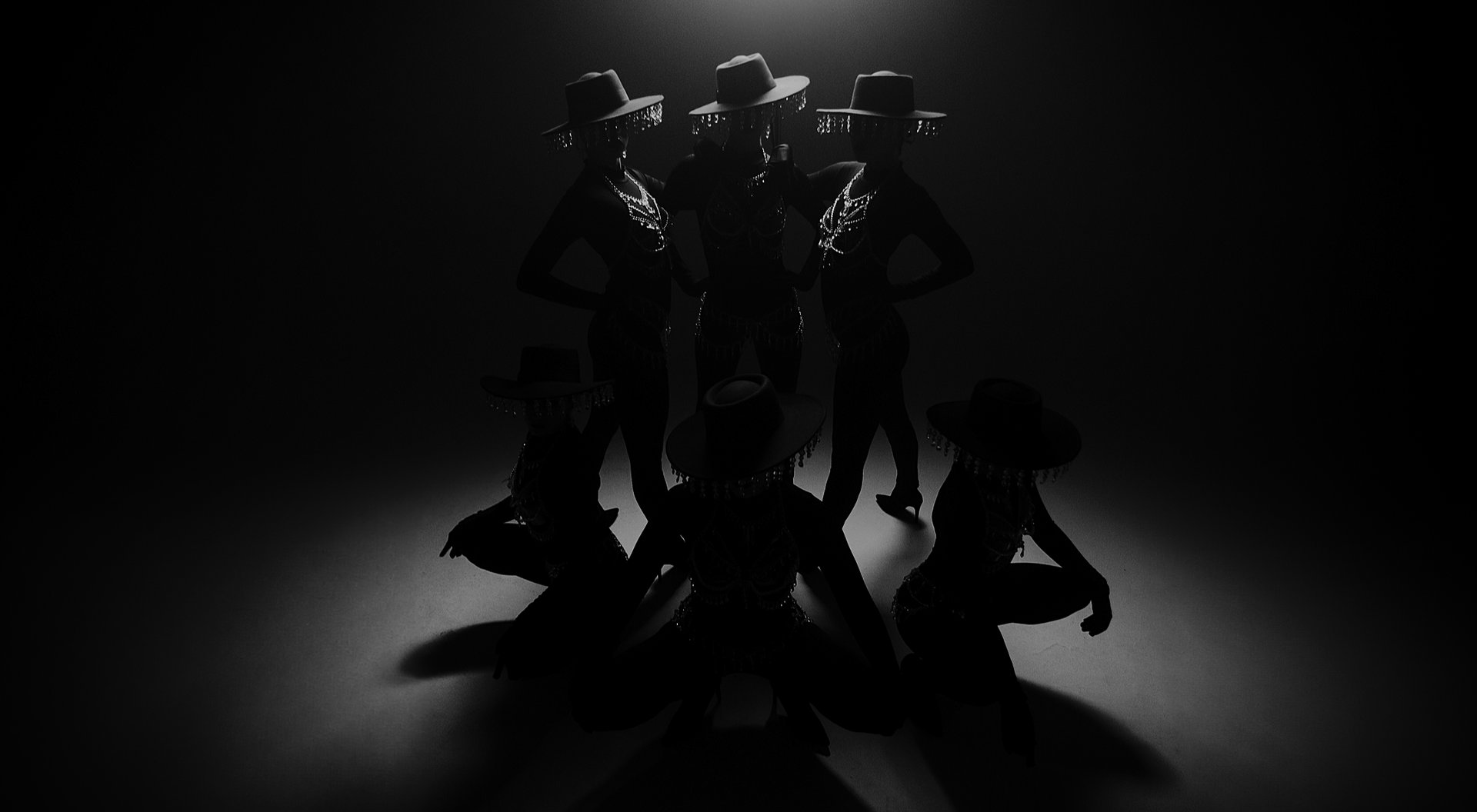 an abstract photo of a curved building with a blue sky in the background