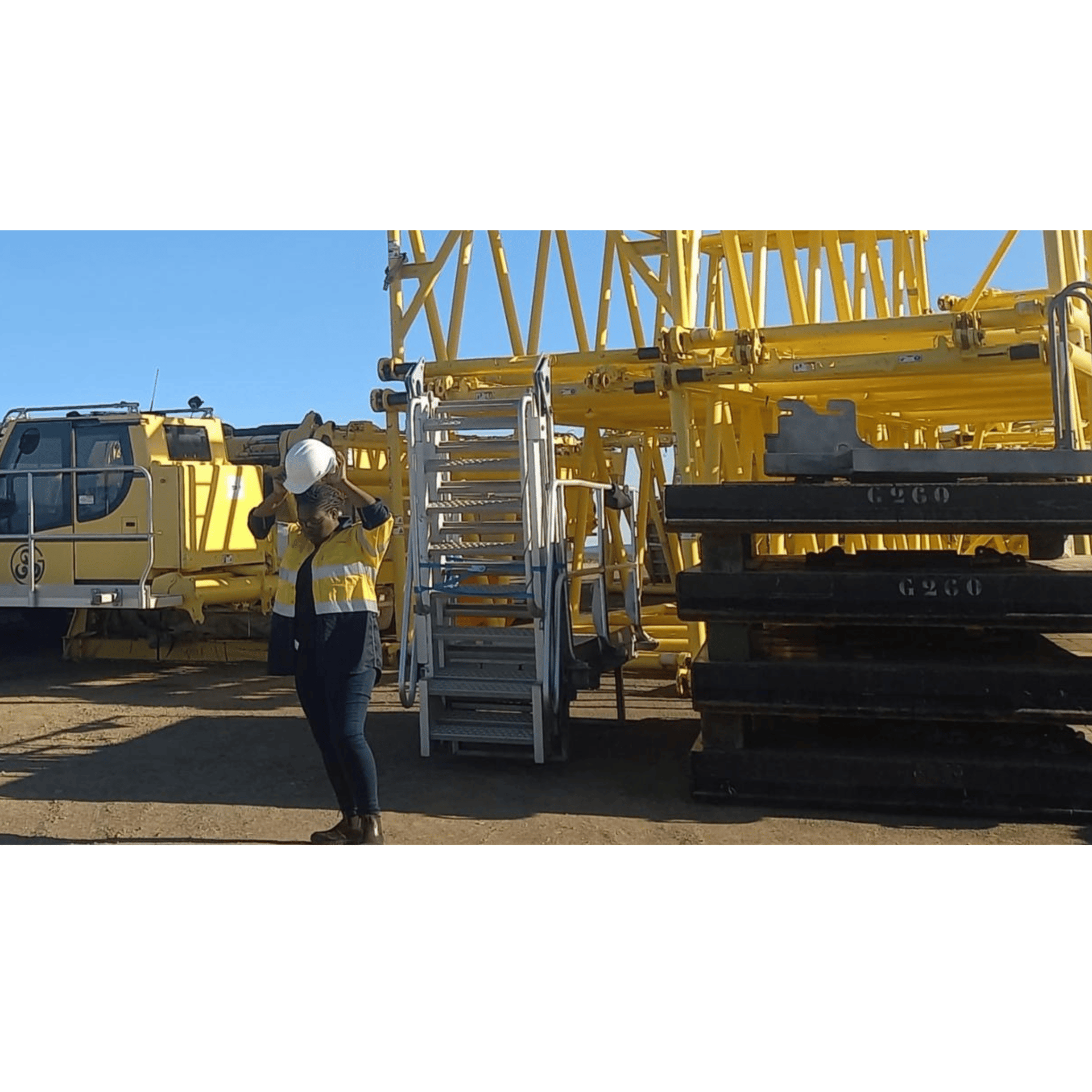 an abstract photo of a curved building with a blue sky in the background
