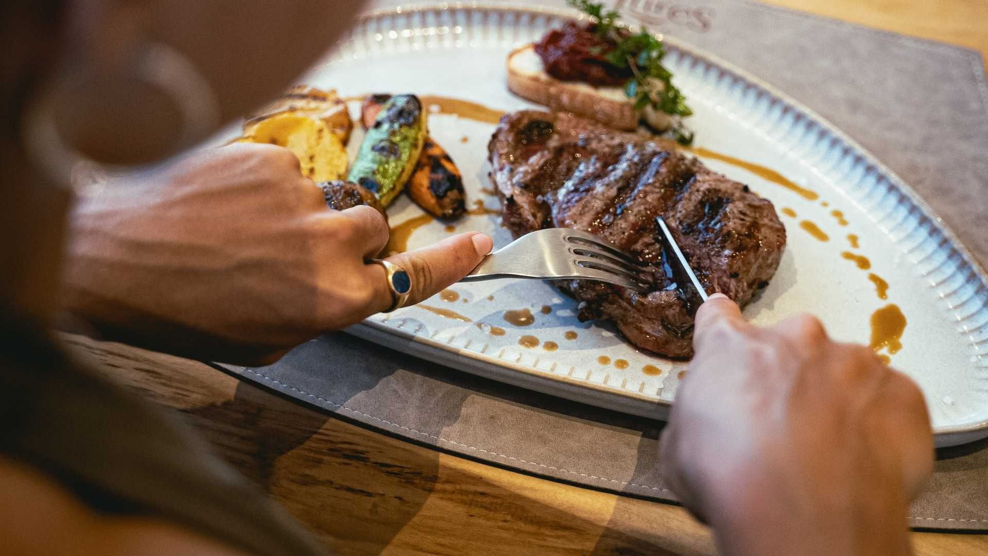 an abstract photo of a curved building with a blue sky in the background