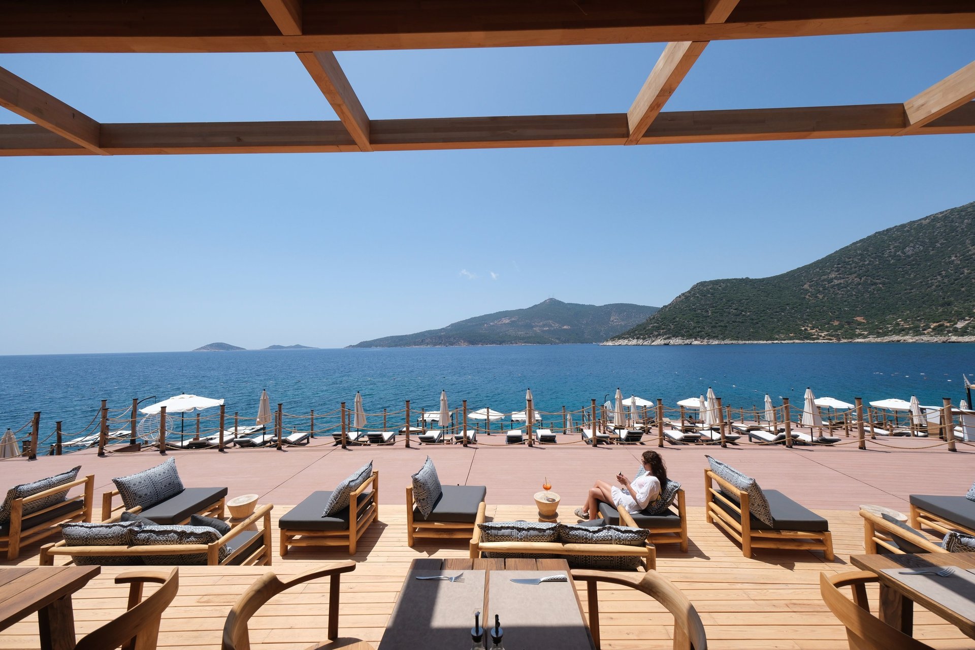 an abstract photo of a curved building with a blue sky in the background