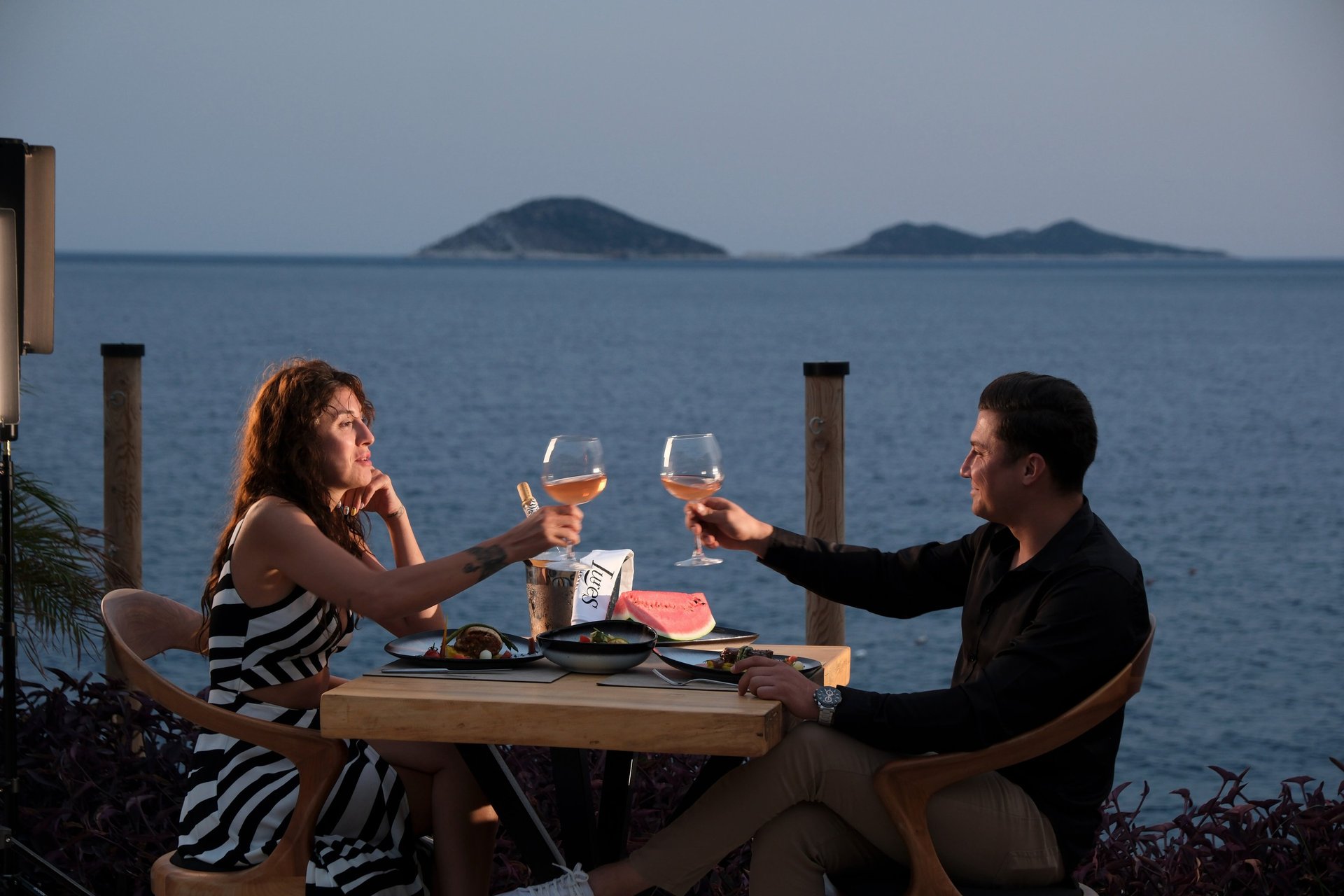 an abstract photo of a curved building with a blue sky in the background