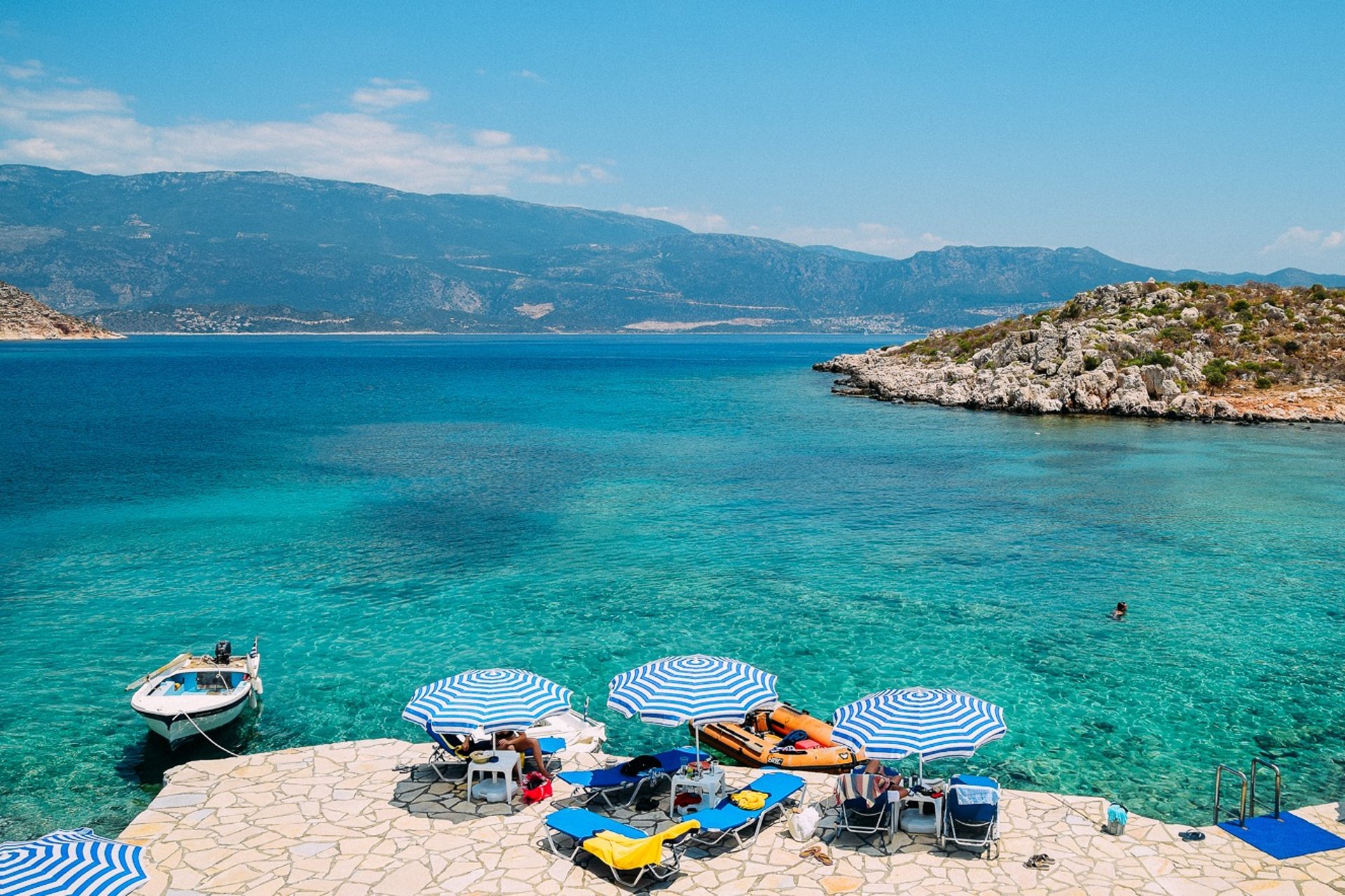 an abstract photo of a curved building with a blue sky in the background
