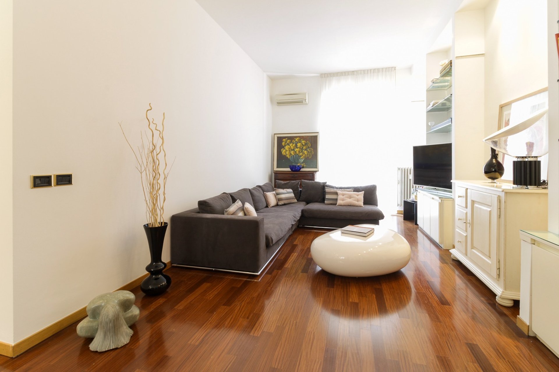 an abstract photo of a curved building with a blue sky in the background