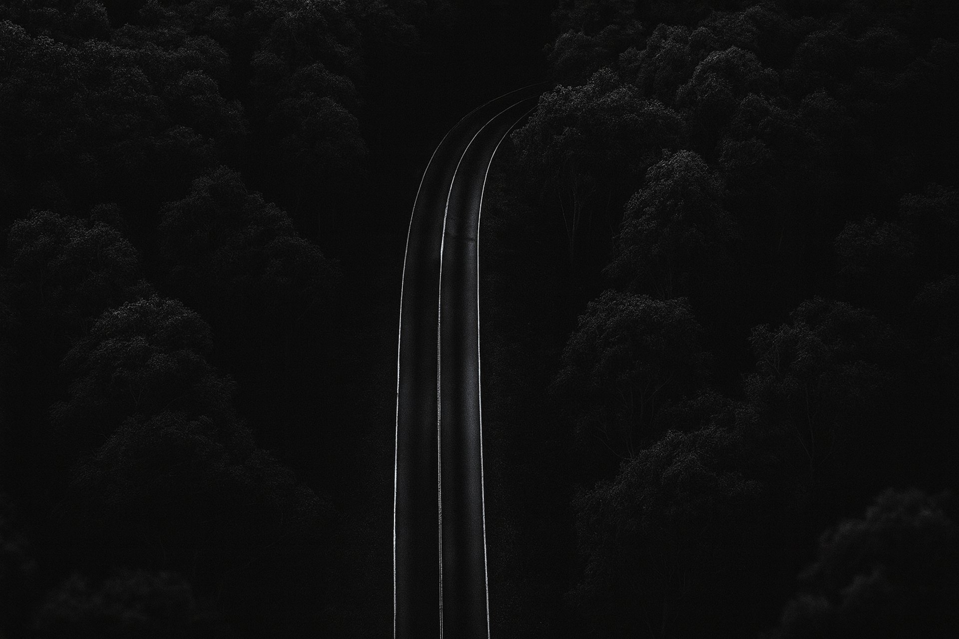 people walking on sidewalk near body of water during night time