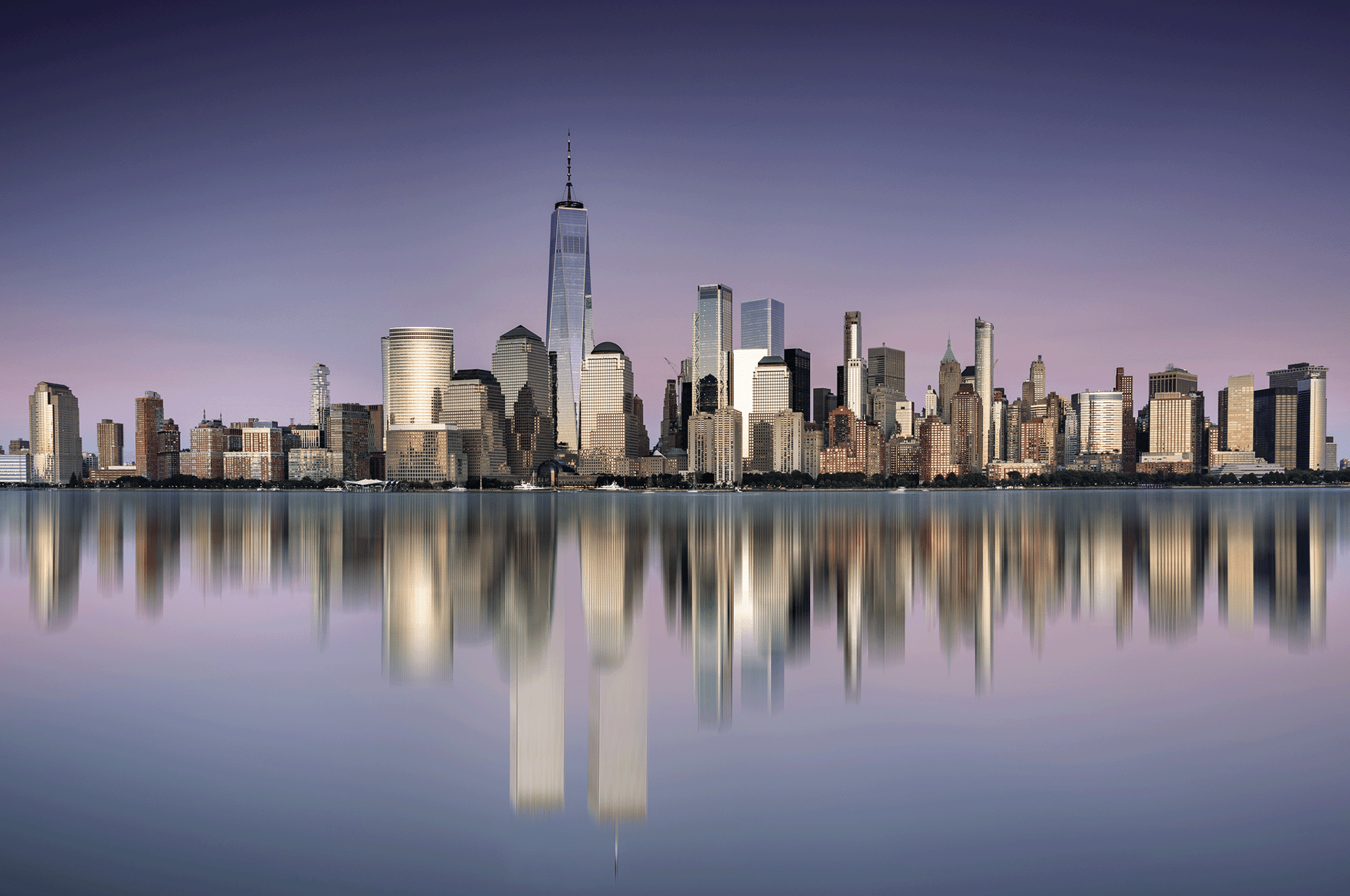 city skyline across body of water during daytime
