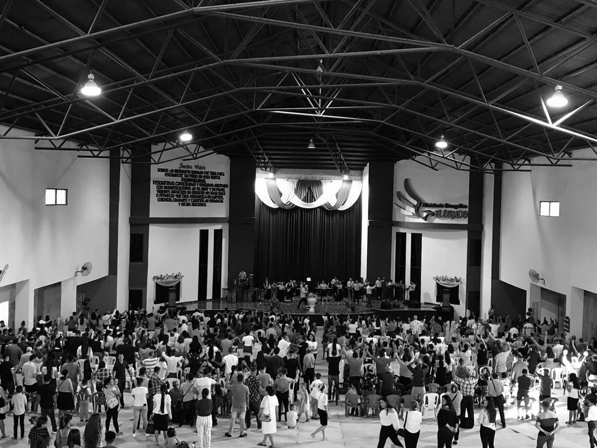an abstract photo of a curved building with a blue sky in the background