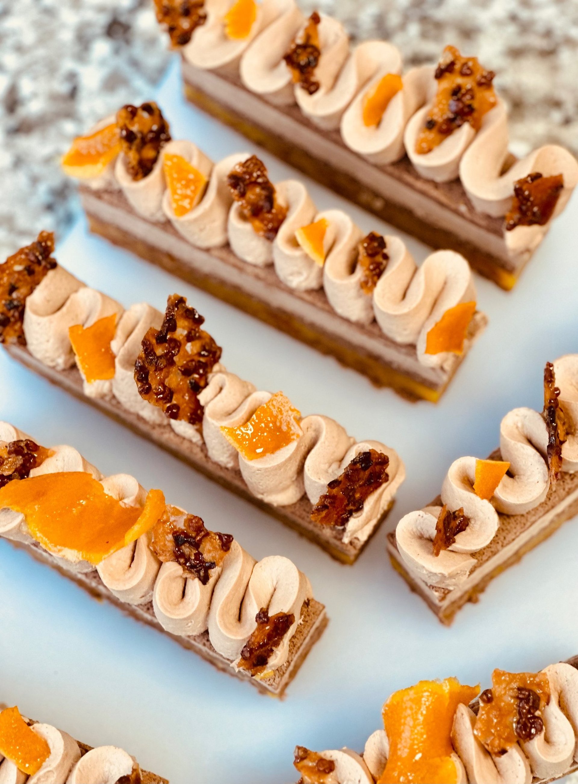 a plate of pears and a leaf on a table