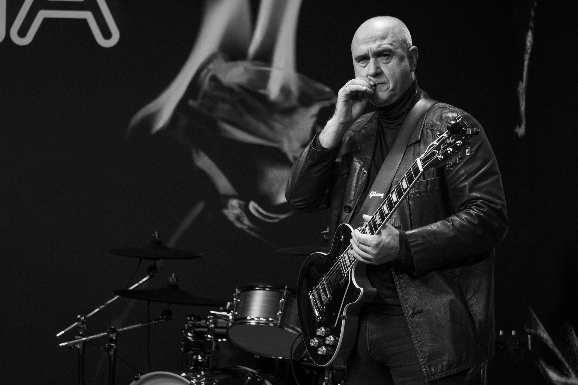 an abstract photo of a curved building with a blue sky in the background