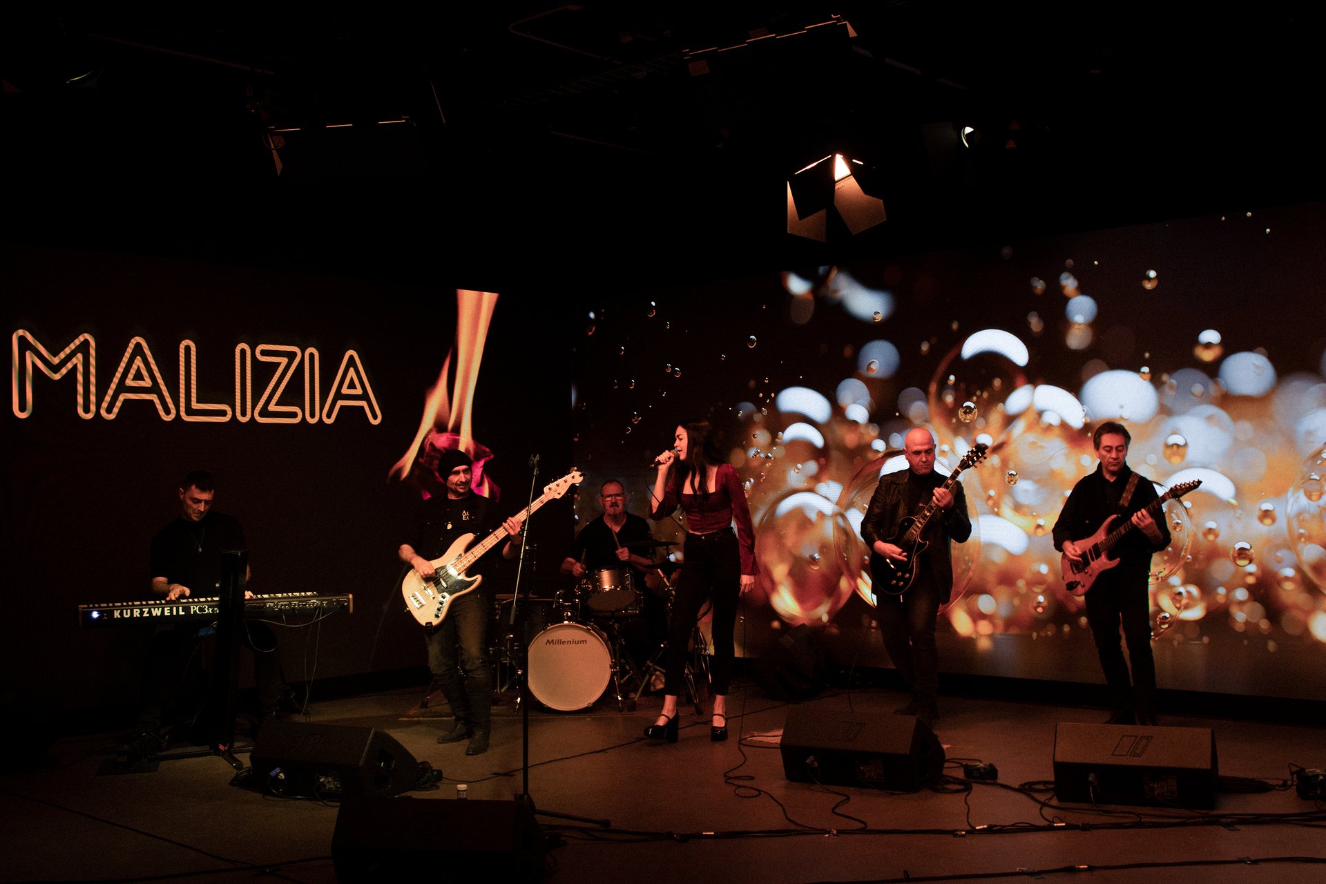 an abstract photo of a curved building with a blue sky in the background