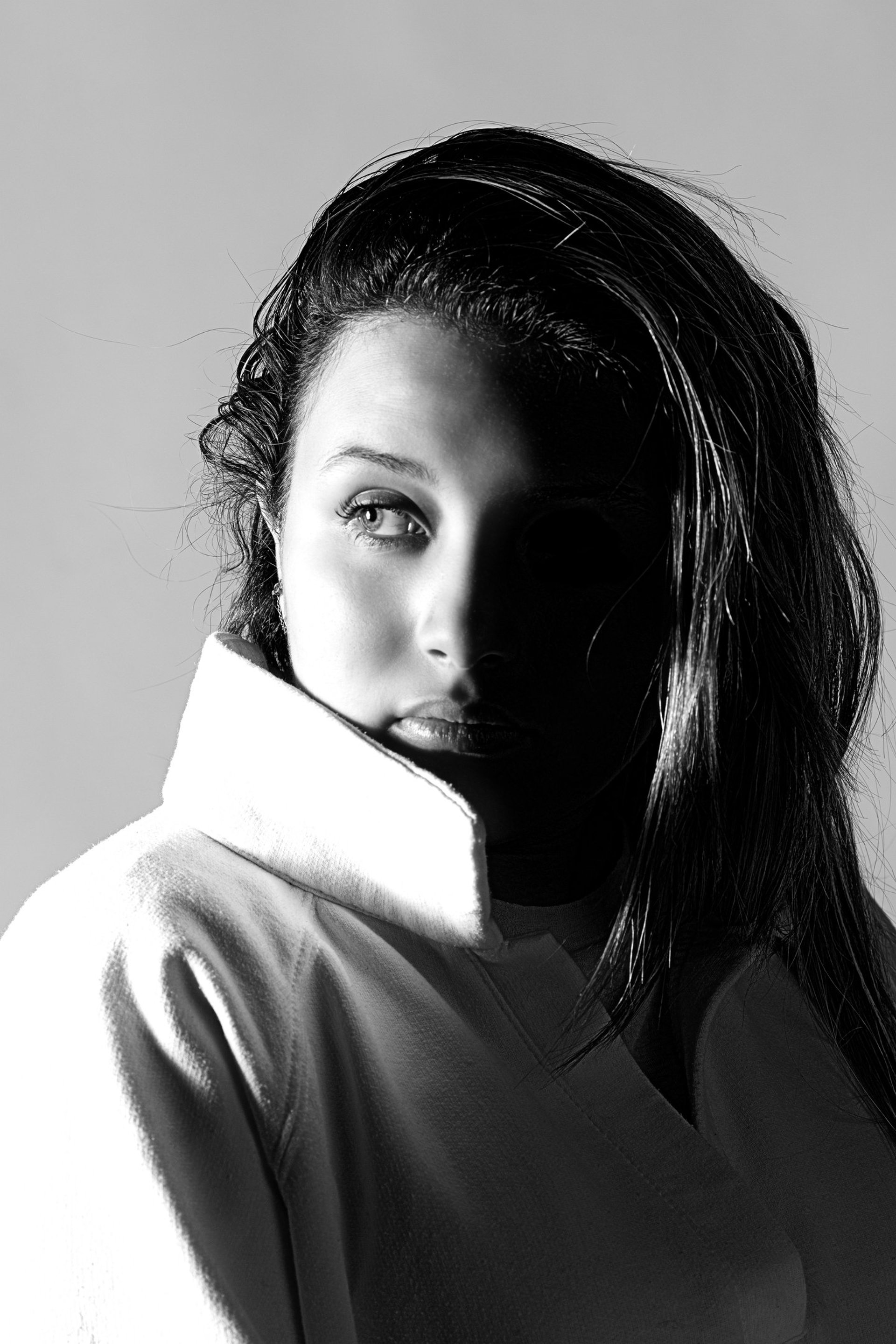 an abstract photo of a curved building with a blue sky in the background