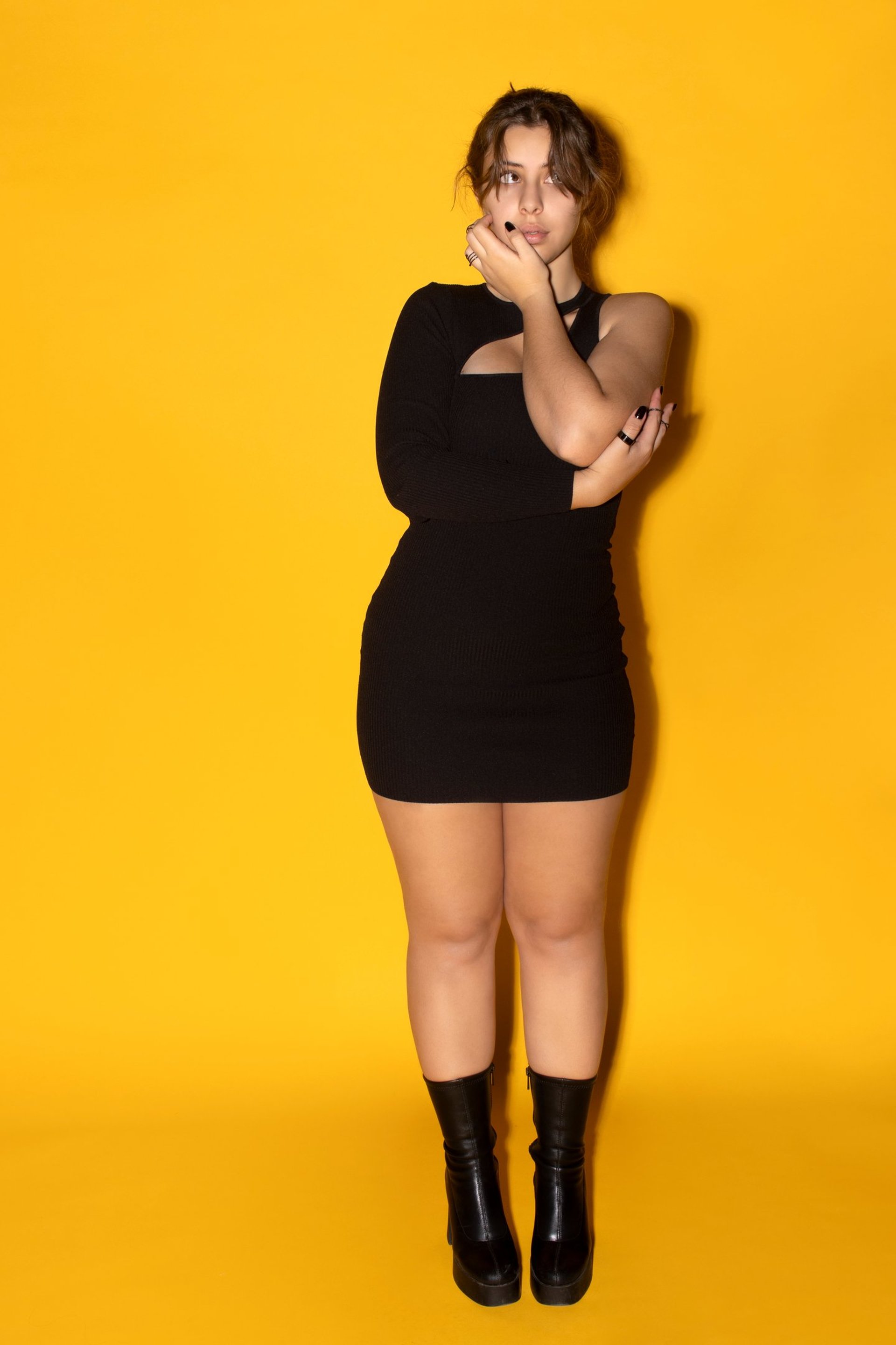 an abstract photo of a curved building with a blue sky in the background