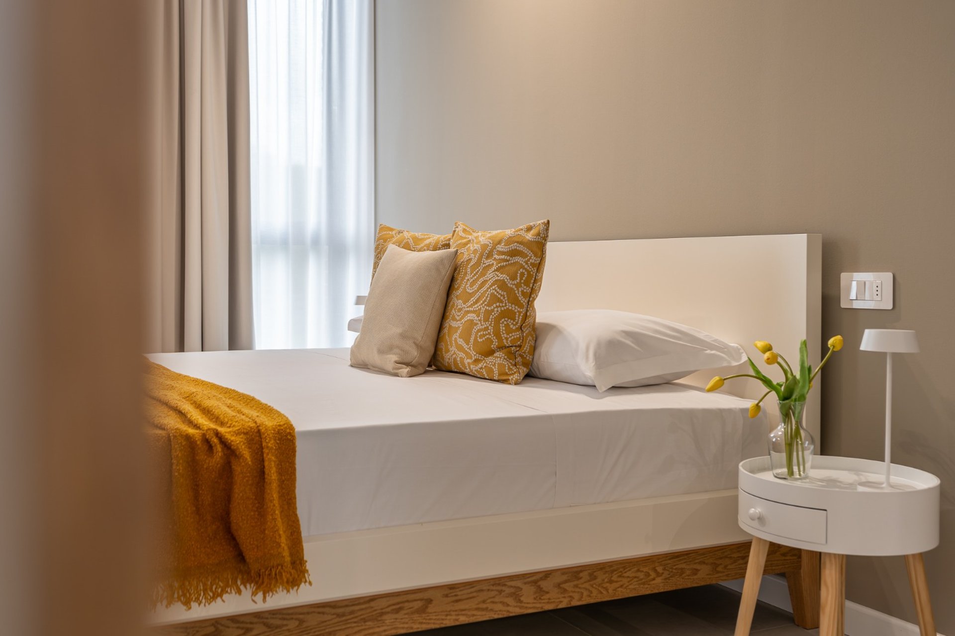 woman wearing yellow long-sleeved dress under white clouds and blue sky during daytime