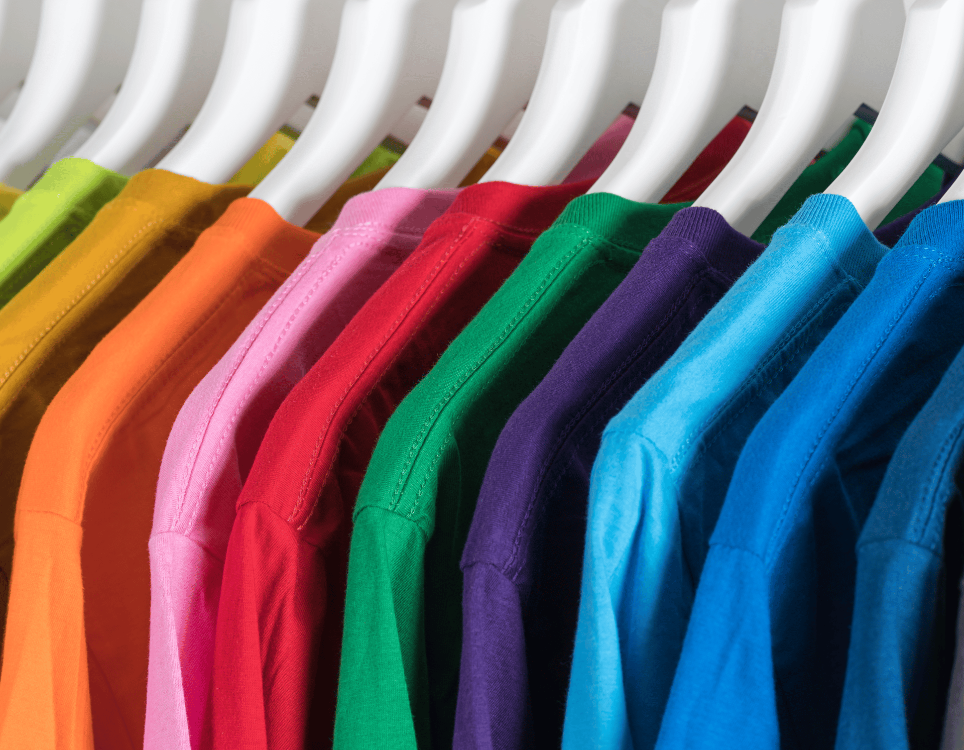 photo of white and pink t-shirts