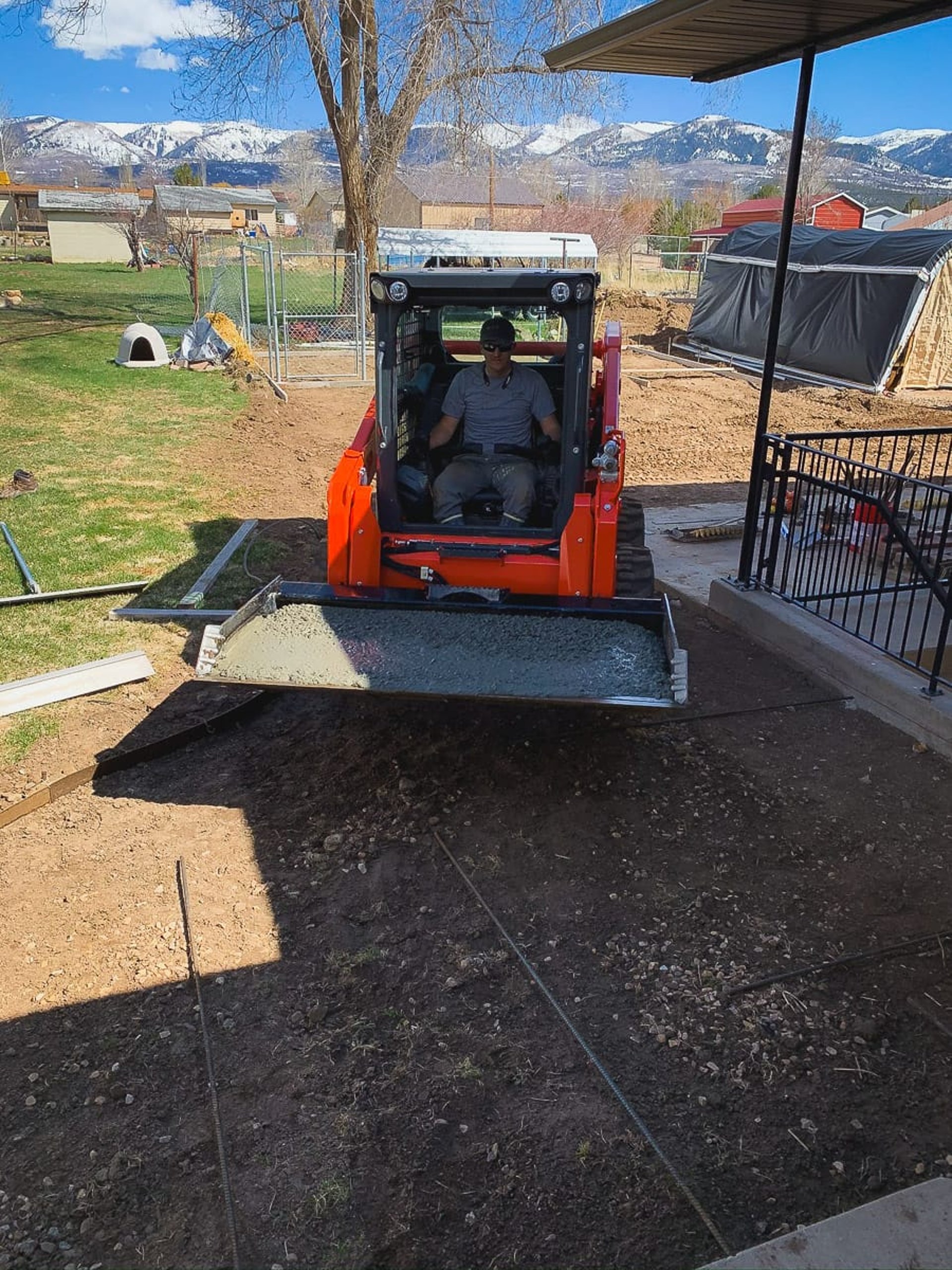 an abstract photo of a curved building with a blue sky in the background