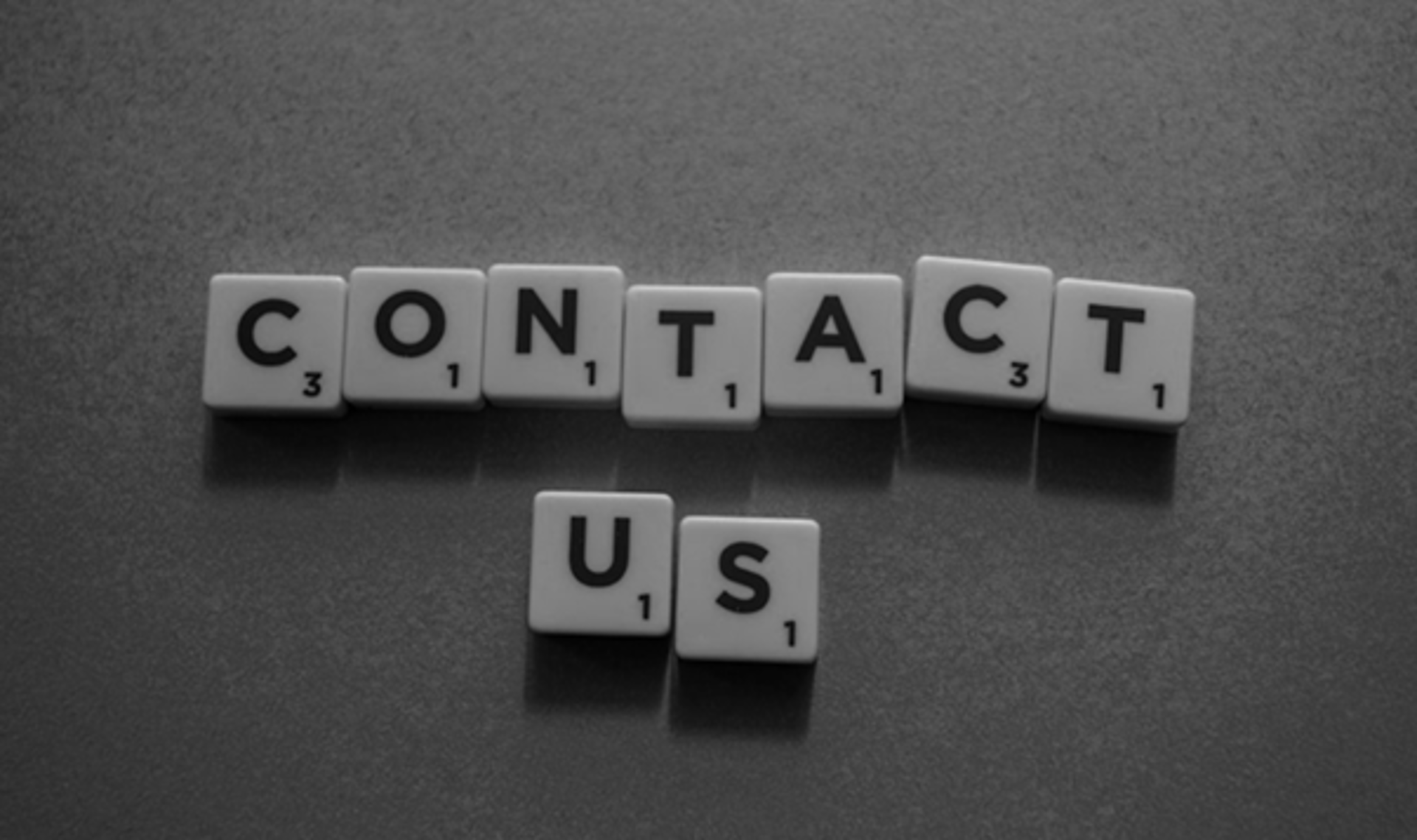 person using black typewriter