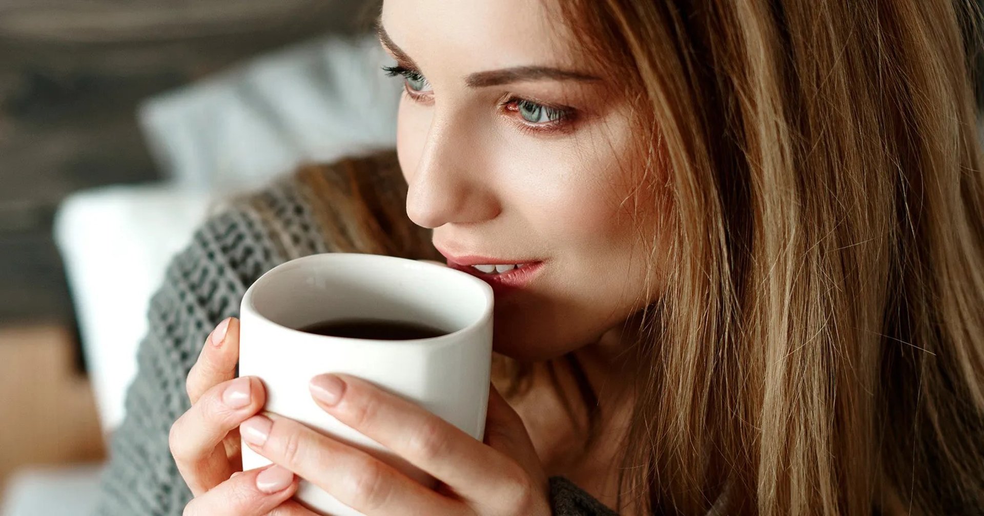 an abstract photo of a curved building with a blue sky in the background