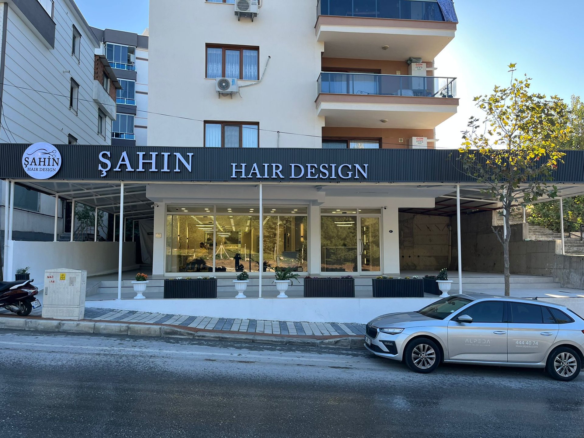 black leather barber chair near brown brick wall