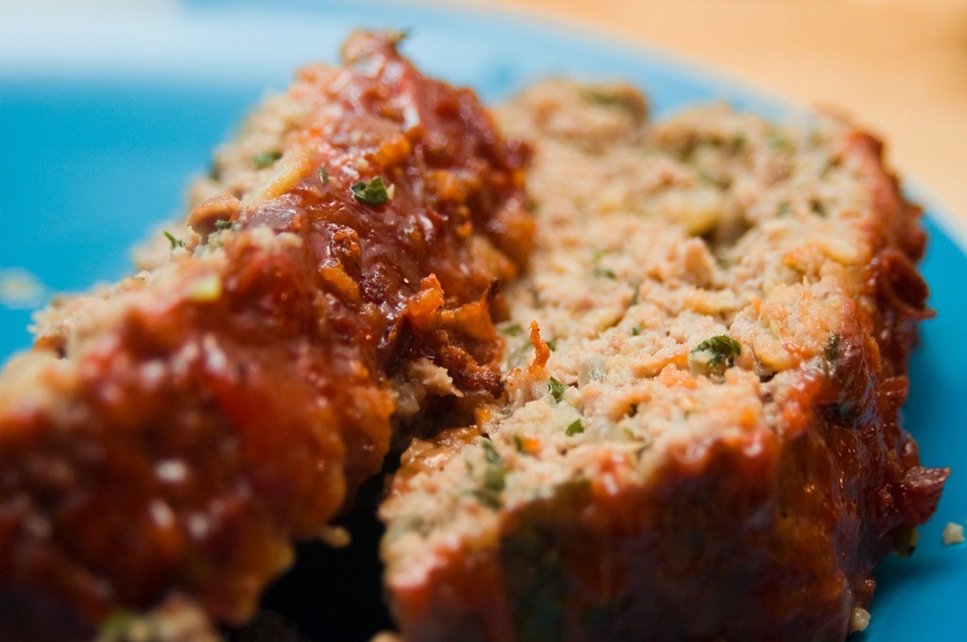 two pieces of meatloaf on a plate