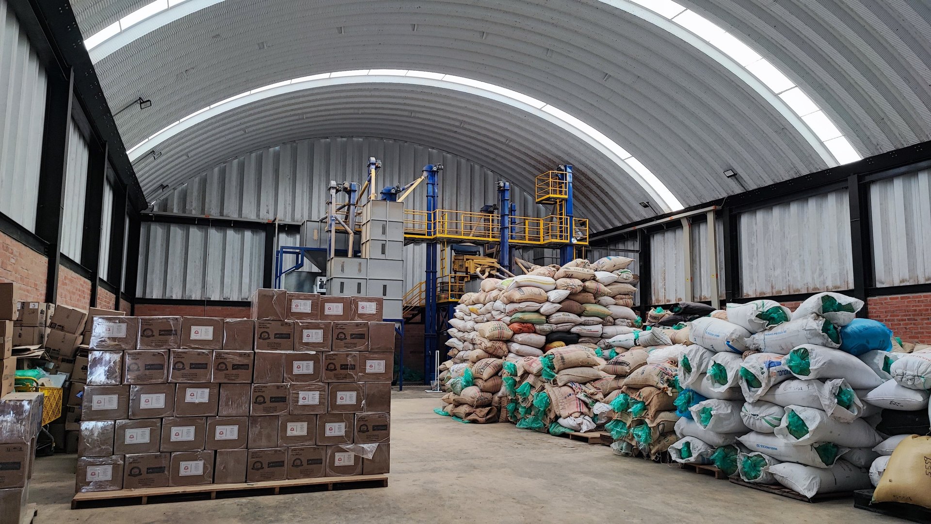 an abstract photo of a curved building with a blue sky in the background