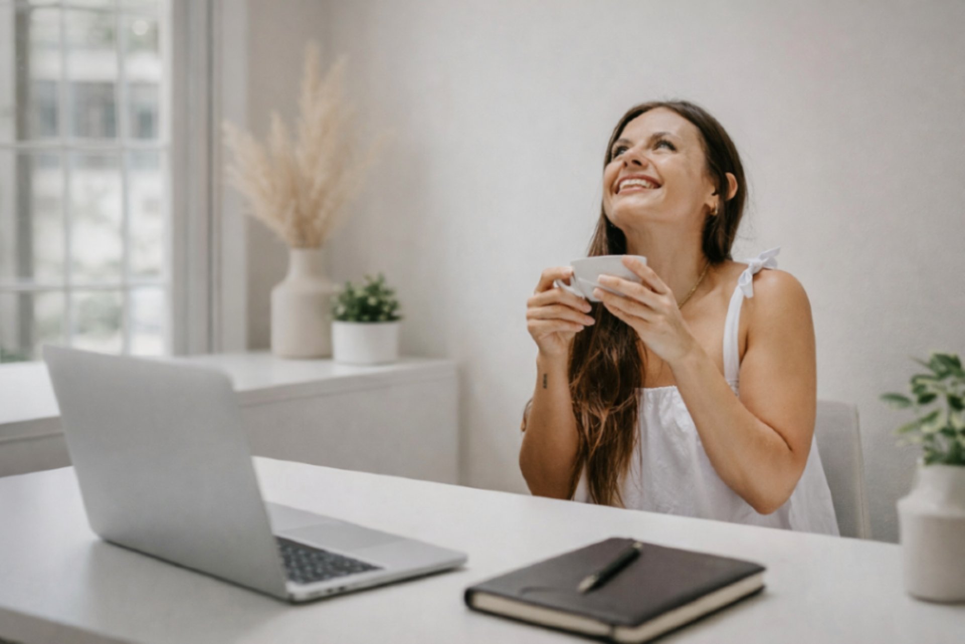 a cup of coffee and a notebook on a table