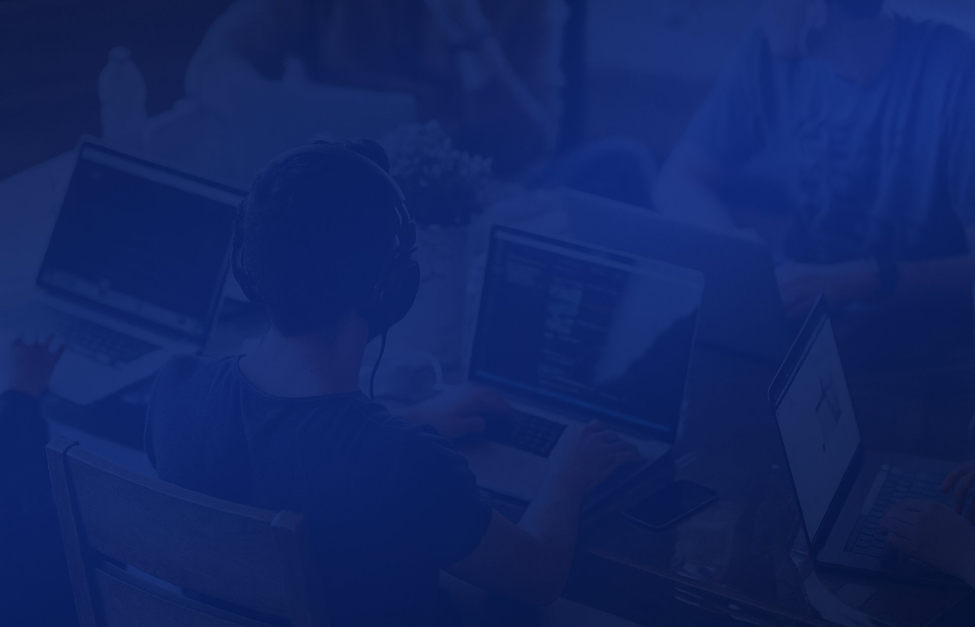 group of people using laptop computer