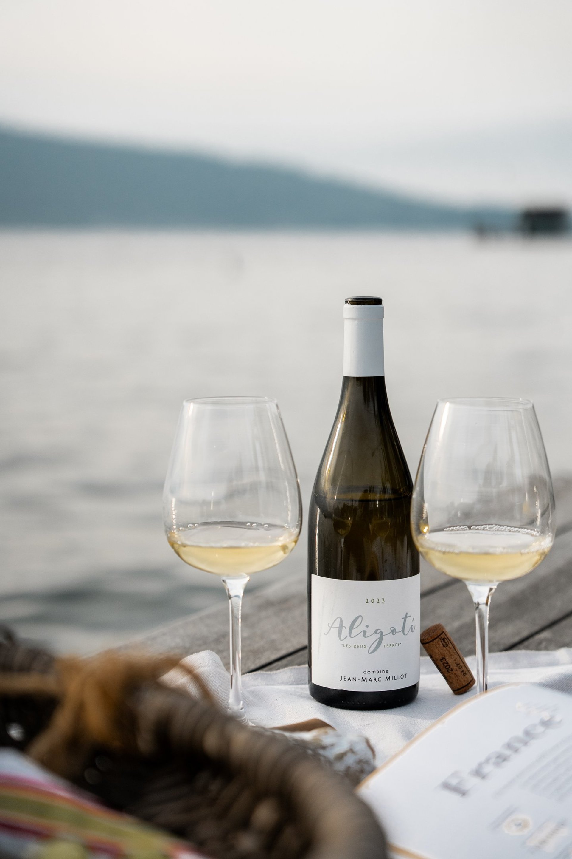 clear wine glass with yellow liquid