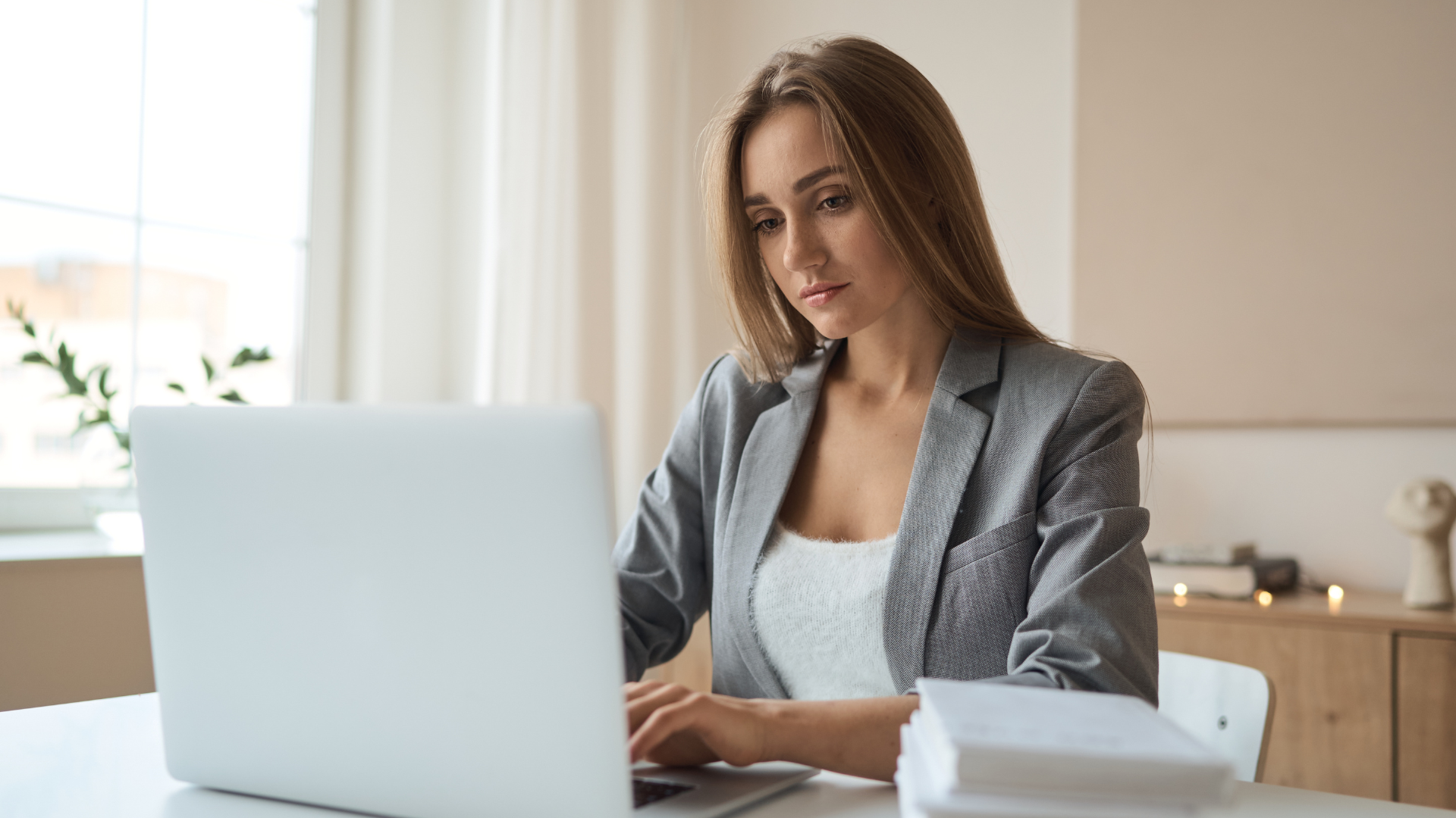 an abstract photo of a curved building with a blue sky in the background