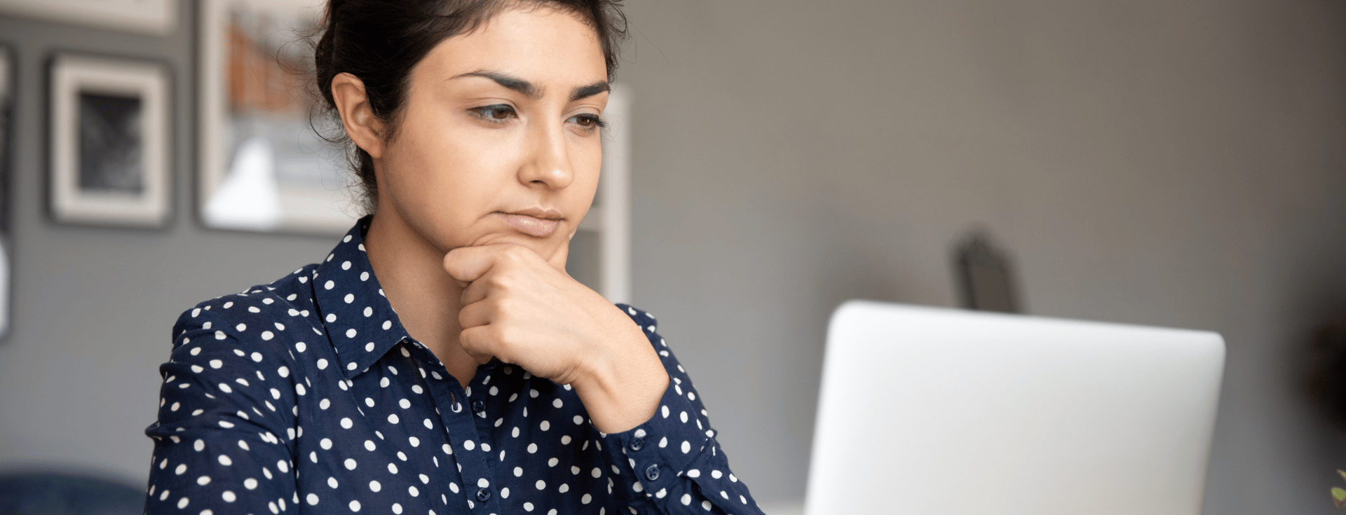 an abstract photo of a curved building with a blue sky in the background