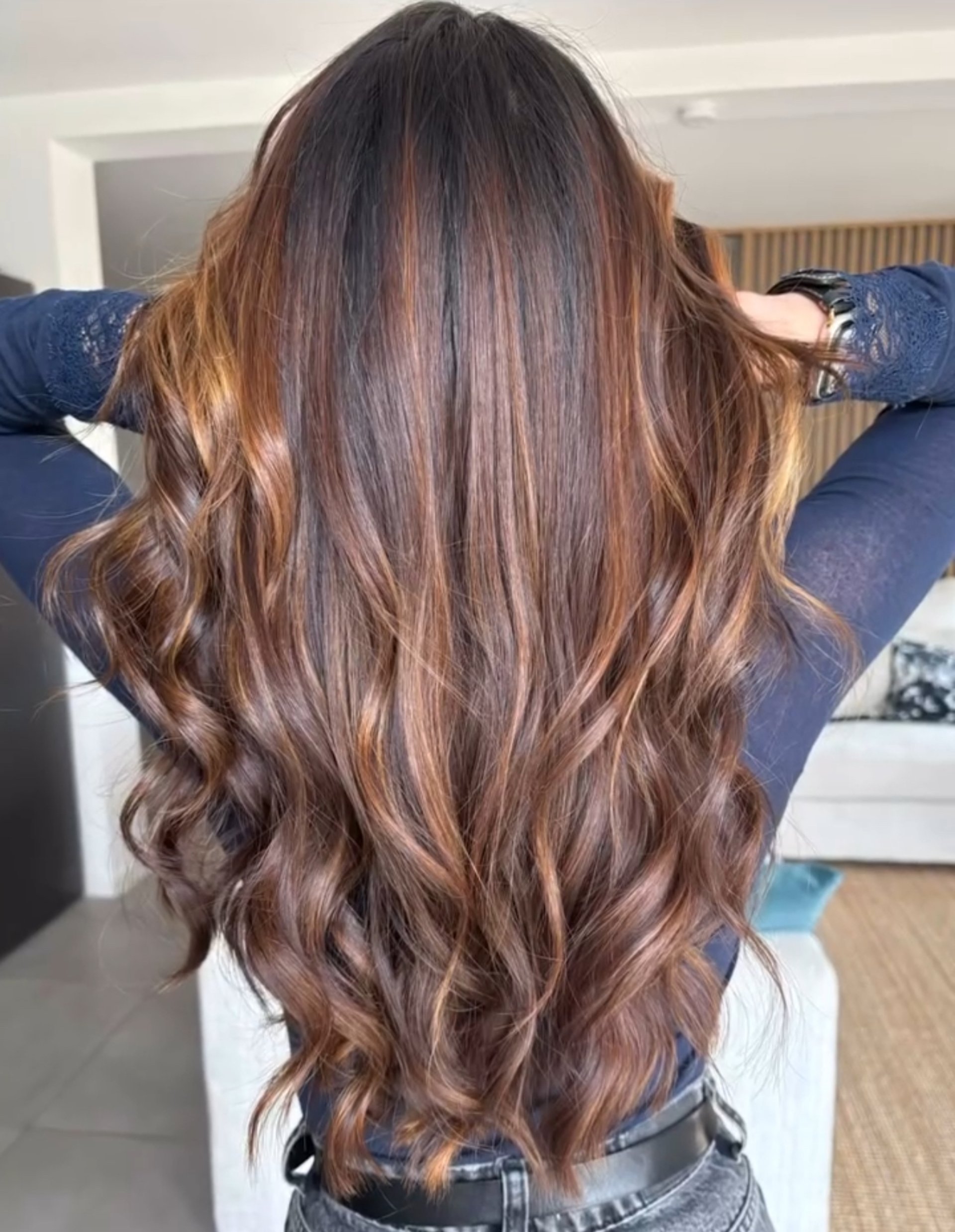 person in black leather gloves