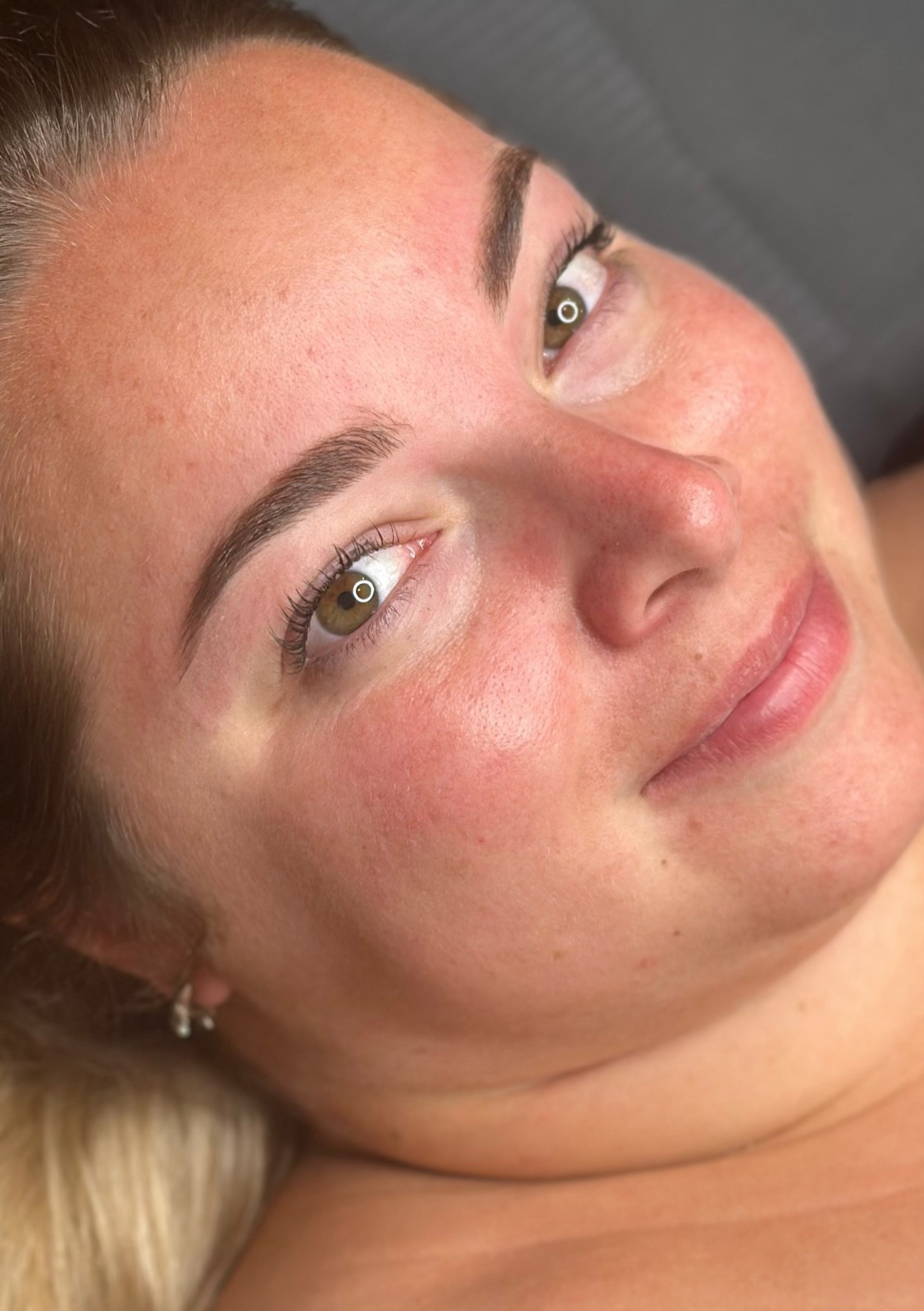 woman with blue eyes and brown hair