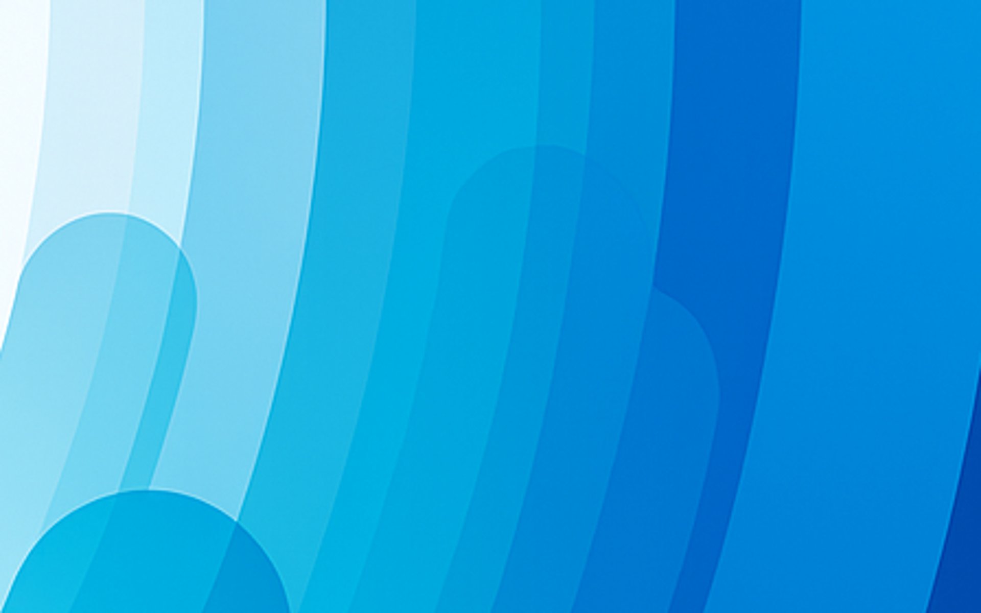 an abstract photo of a curved building with a blue sky in the background