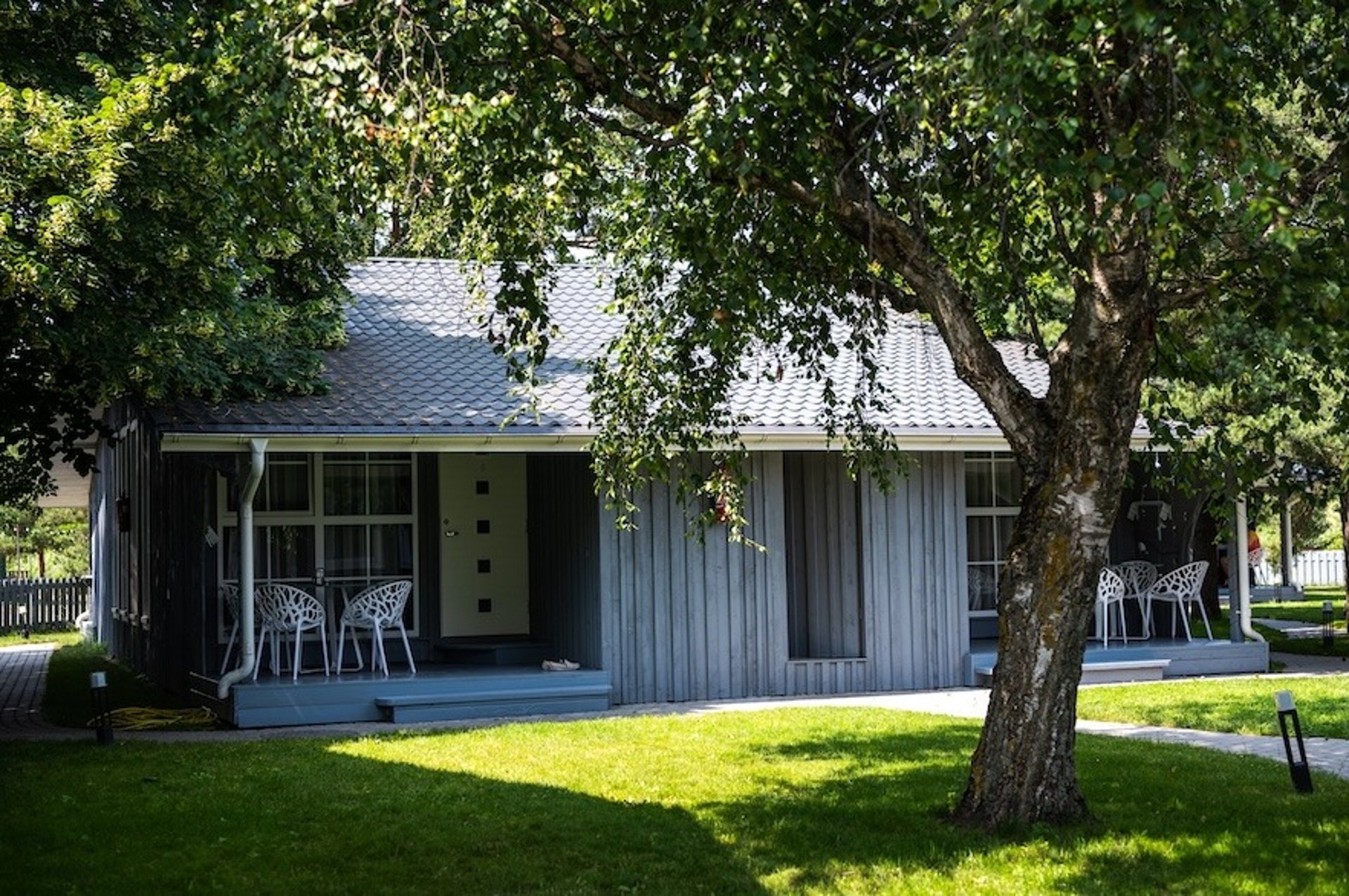 an abstract photo of a curved building with a blue sky in the background