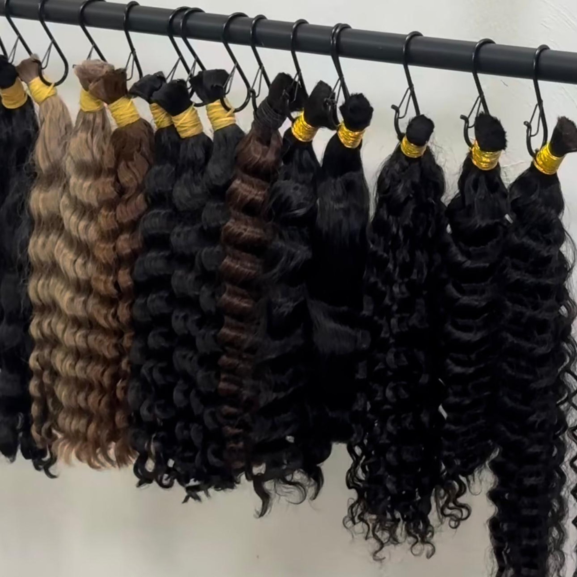 a woman cutting another woman's hair in a salon